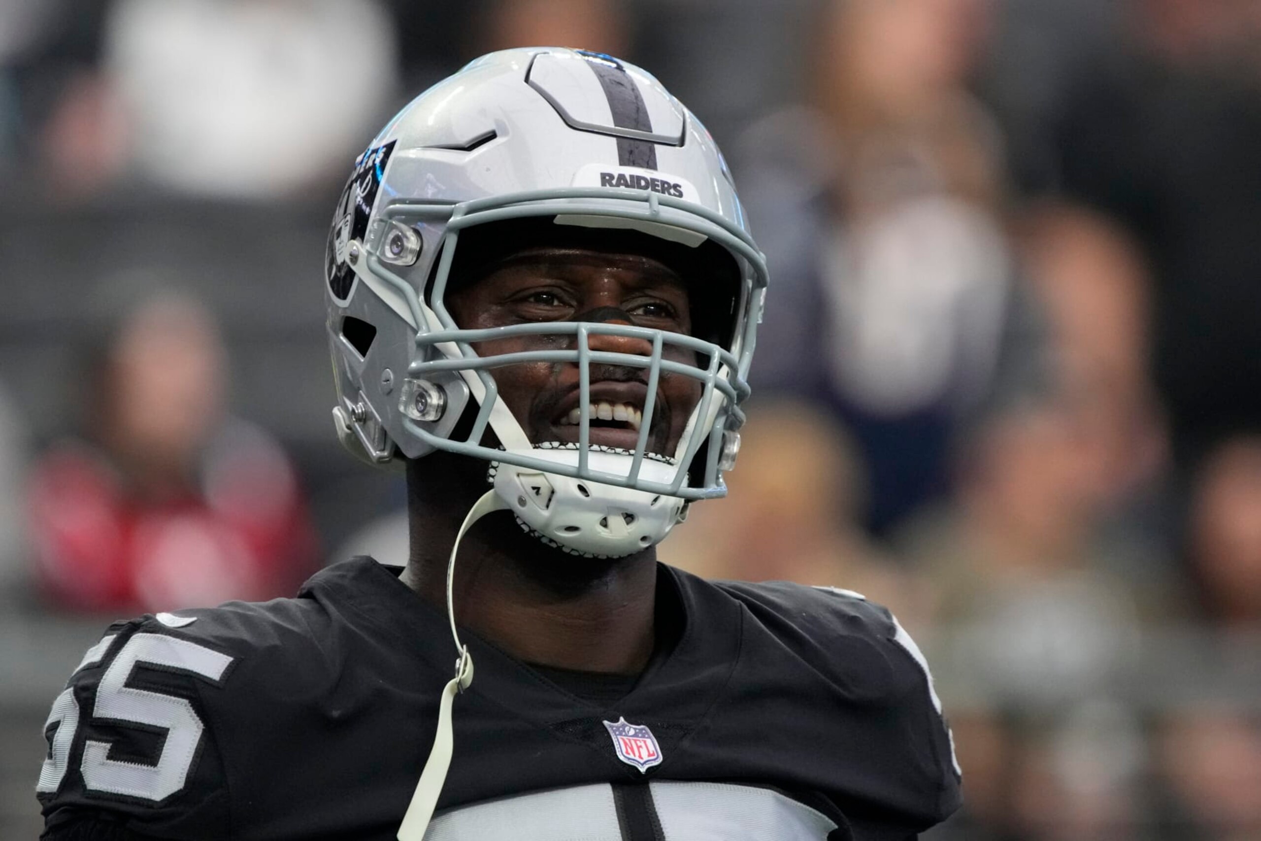 Las Vegas Raiders defensive end Chandler Jones (55) warms up before an NFL football game against the New England Patriots, Sunday, Dec. 18, 2022, in Las Vegas. (AP Photo/Rick Scuteri)