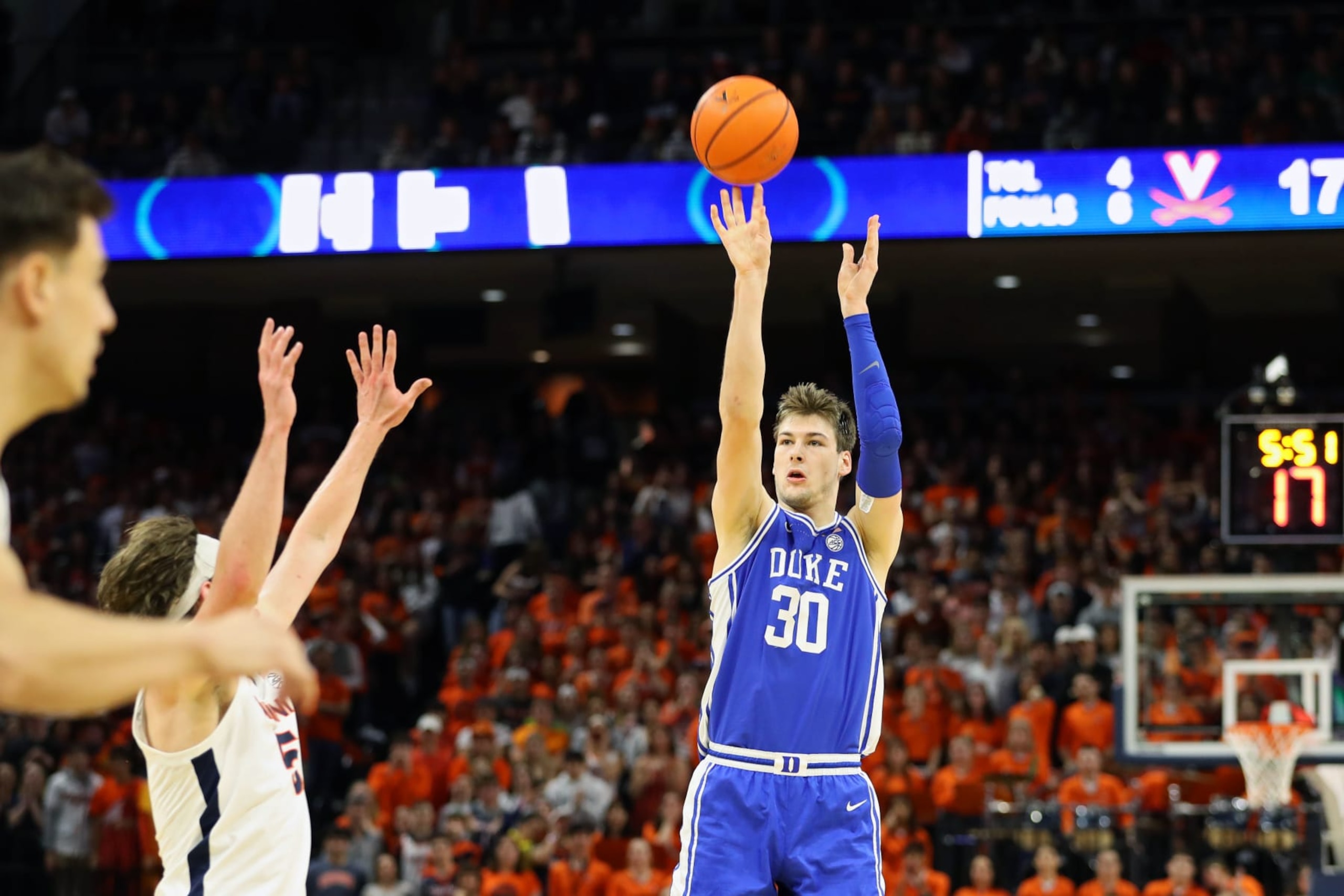 CHARLOTTESVILLE, VA - FEBRUARY 11: Kyle Filipowski #30 of the Duke Blue Devils shoots over Ben Vander Plas #5 of the Virginia Cavaliers in the first half during a game at John Paul Jones Arena on February 11, 2023 in Charlottesville, Virginia. (Photo by Ryan M. Kelly/Getty Images)