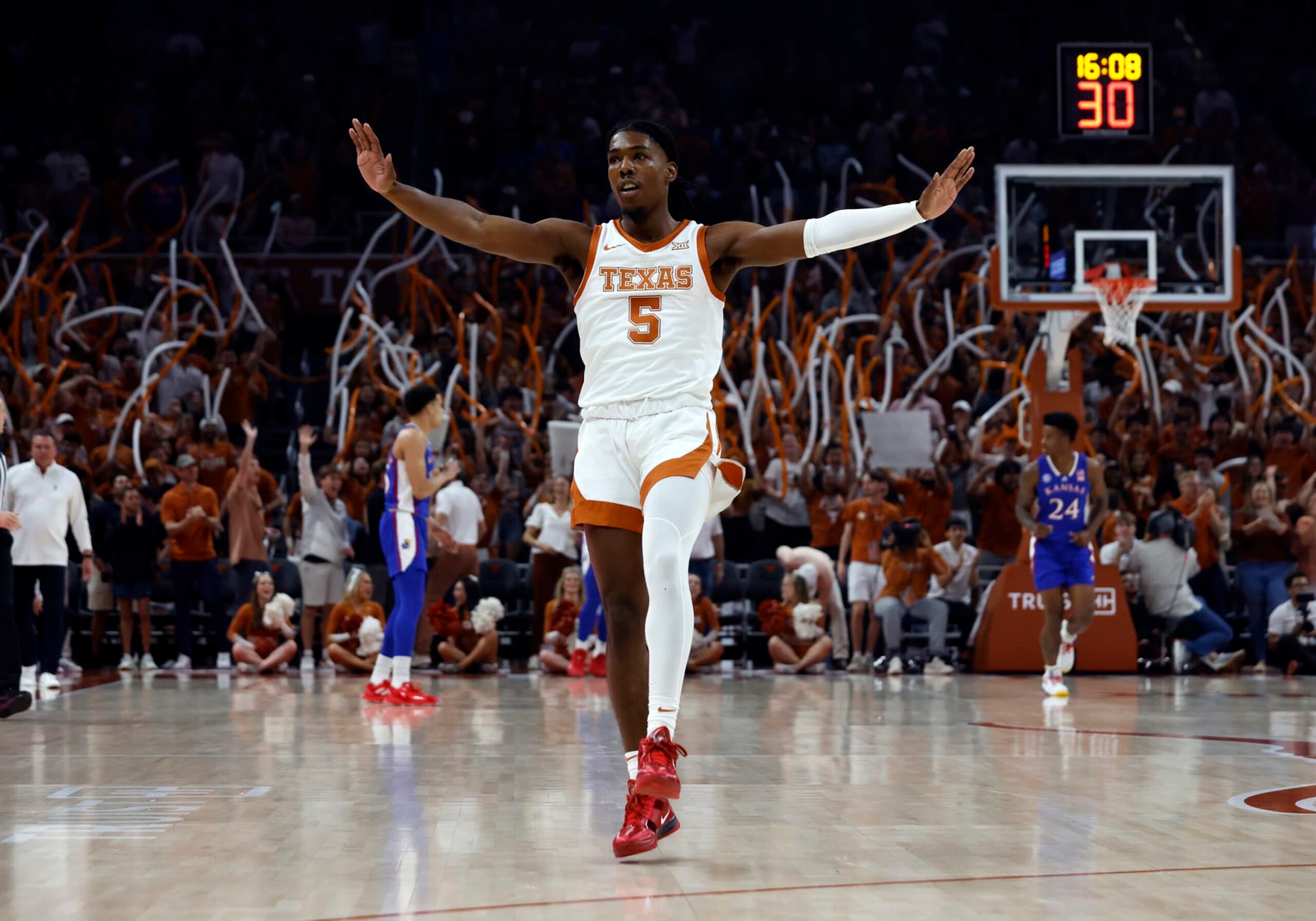 AUSTIN, TX - MARCH 04: Texas Longhorns guard Marcus Carr gets the crowd into the game after making a shot against the Kansas Jayhawks during the game at the Moody Center in Austin, TX on March 04, 2023. (Photo by Adam Davis/Icon Sportswire via Getty Images)