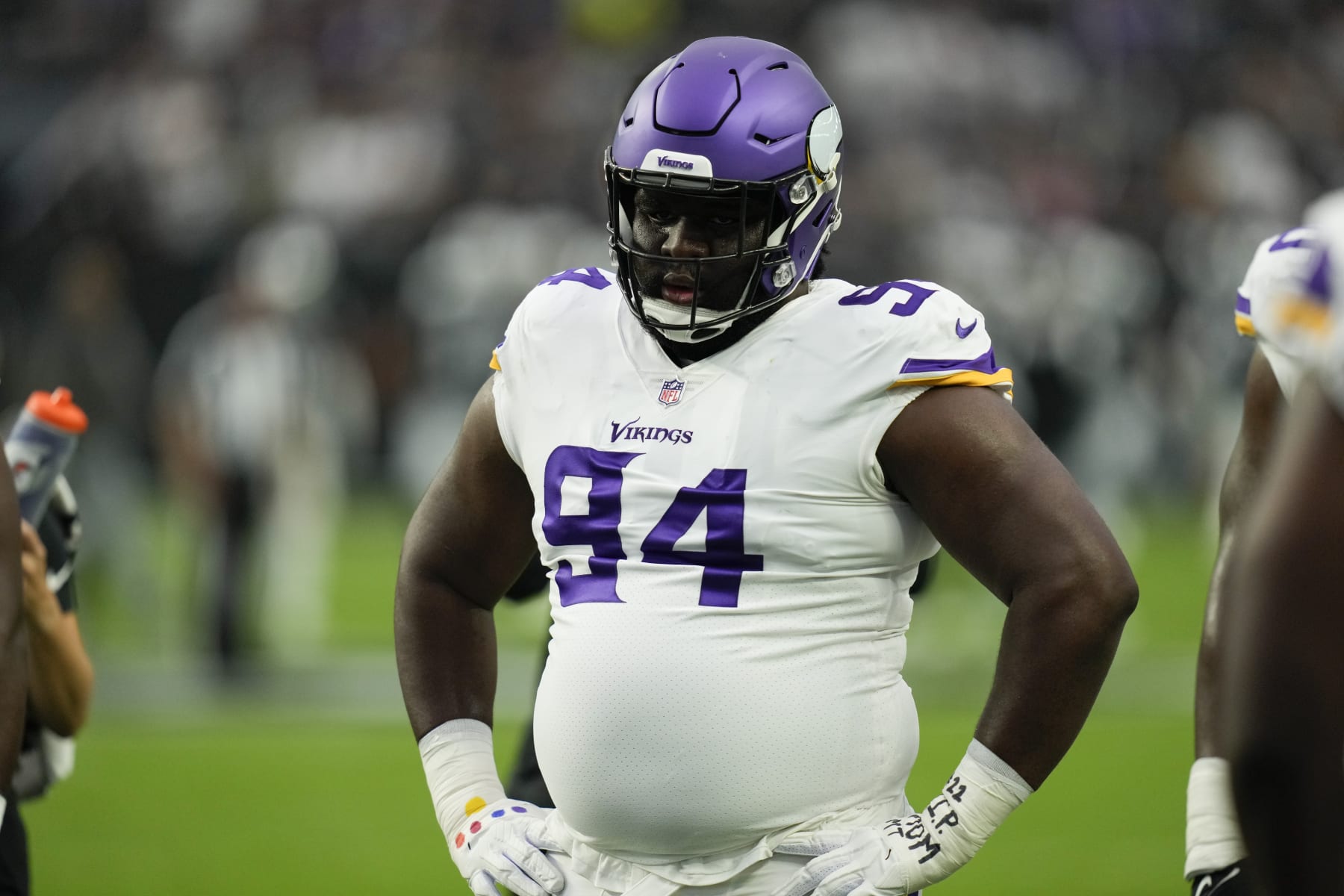 Minnesota Vikings defensive tackle Dalvin Tomlinson watches during warm ups before an NFL preseason football game against the Las Vegas Raiders, Sunday, Aug. 14, 2022, in Las Vegas. (AP Photo/John Locher)