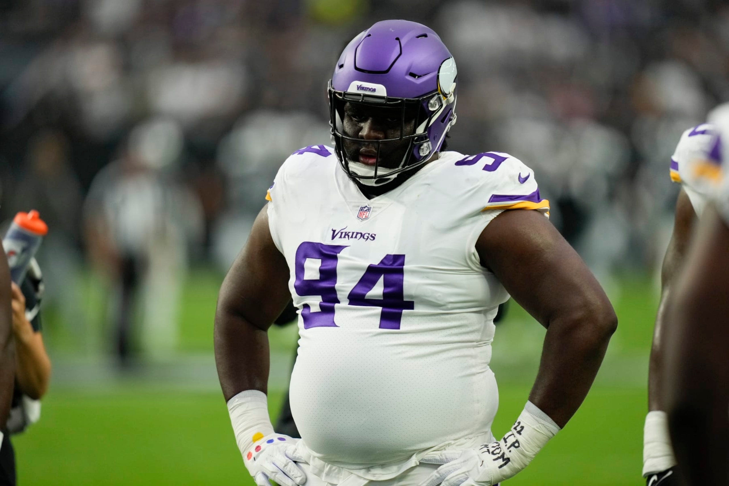 Minnesota Vikings defensive tackle Dalvin Tomlinson watches during warm ups before an NFL preseason football game against the Las Vegas Raiders, Sunday, Aug. 14, 2022, in Las Vegas. (AP Photo/John Locher)