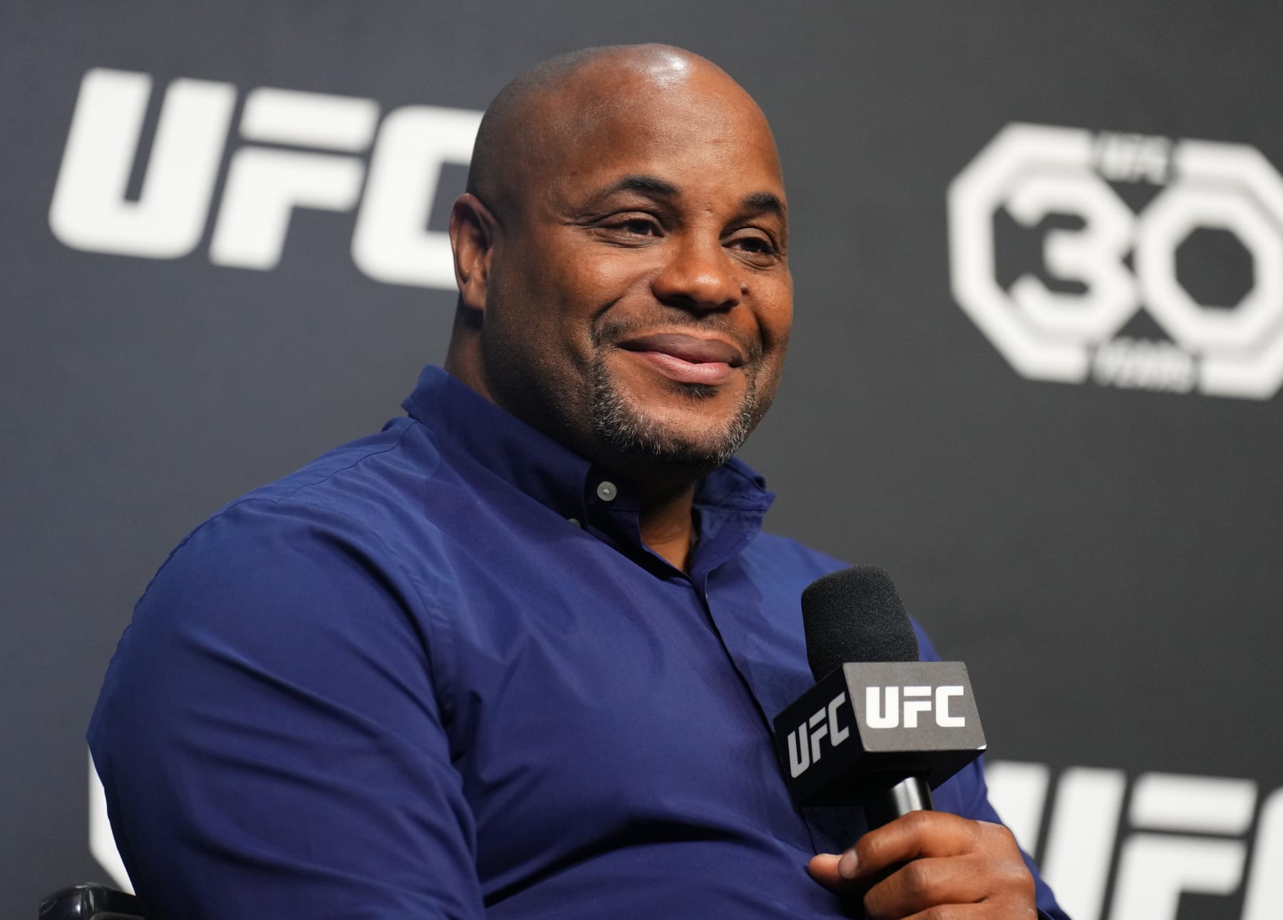 LAS VEGAS, NEVADA - MARCH 03: Former UFC two-division champion Daniel Cormier is seen on stage during the UFC 30th Anniversary Q&A session at MGM Grand Garden Arena on March 03, 2023 in Las Vegas, Nevada. (Photo by Chris Unger/Zuffa LLC via Getty Images)