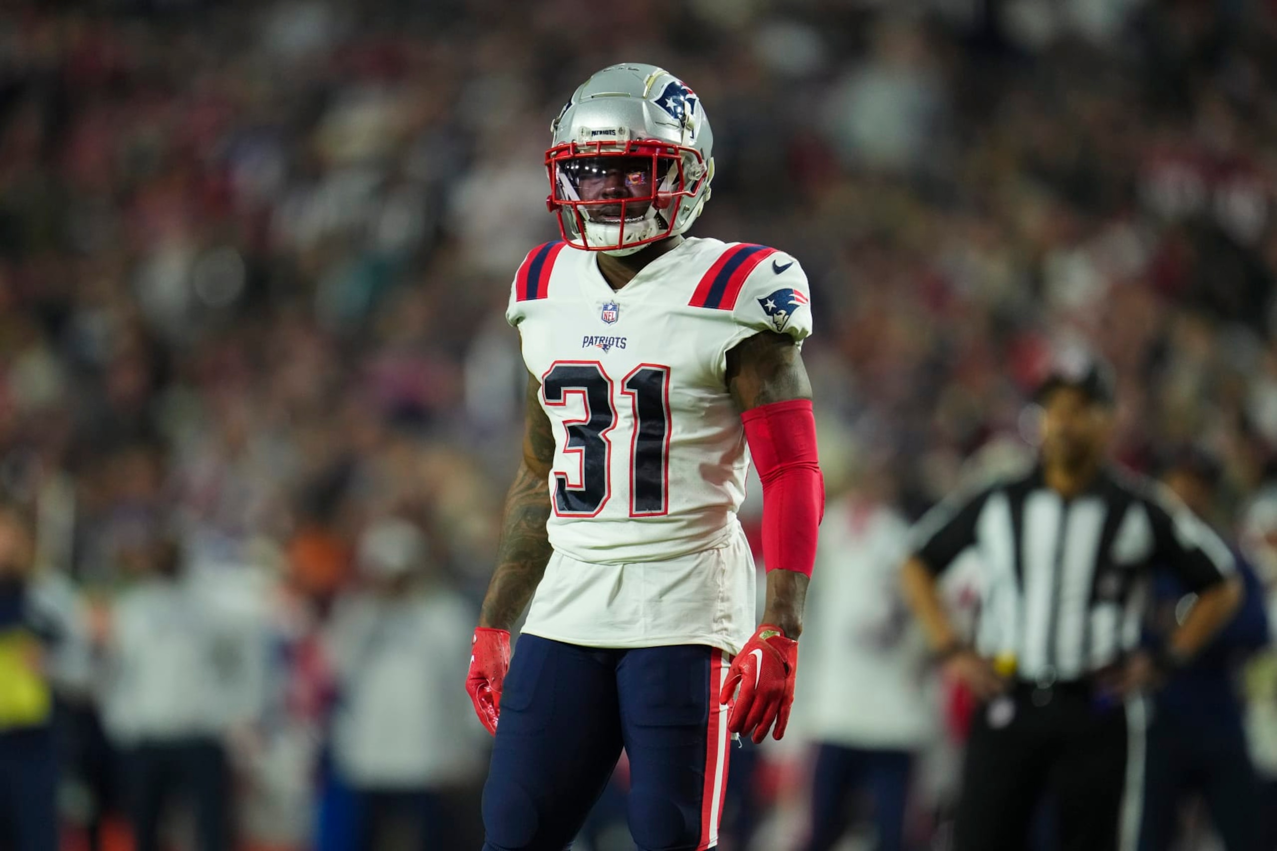 GLENDALE, AZ - DECEMBER 12: Jonathan Jones #31 of the New England Patriots gets set against the Arizona Cardinals at State Farm Stadium on December 12, 2022 in Glendale, Arizona. (Photo by Cooper Neill/Getty Images)