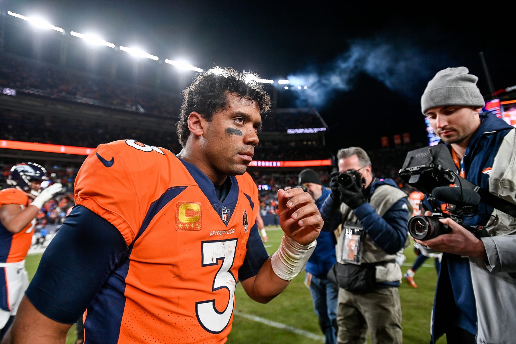 DENVER, CO - JANUARY 8: Denver Broncos quarterback Russell Wilson (3) on the field after a win against the Los Angeles Chargers after a game at Empower Field at Mile High on January 8, 2023 in Denver, Colorado. (Photo by Dustin Bradford/Icon Sportswire via Getty Images)
