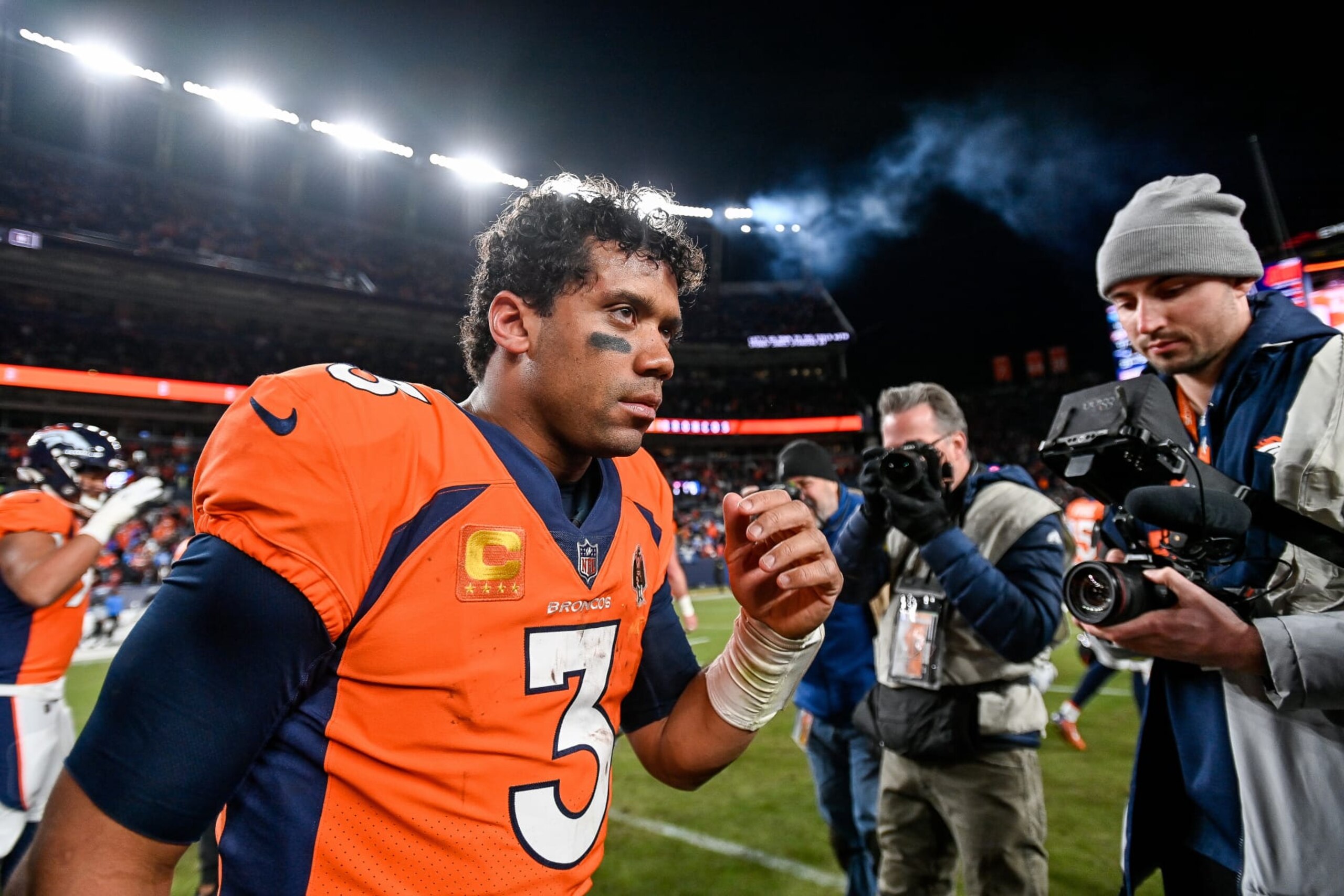 DENVER, CO - JANUARY 8: Denver Broncos quarterback Russell Wilson (3) on the field after a win against the Los Angeles Chargers after a game at Empower Field at Mile High on January 8, 2023 in Denver, Colorado. (Photo by Dustin Bradford/Icon Sportswire via Getty Images)