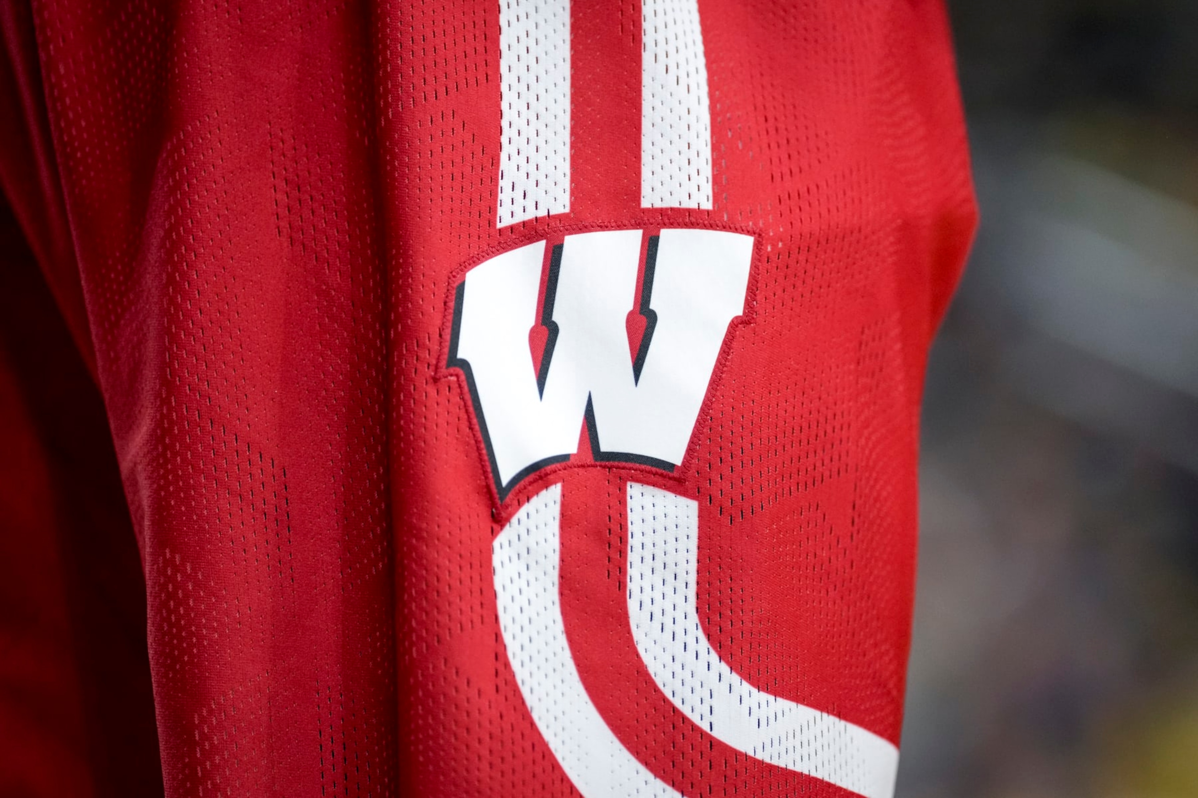 ANN ARBOR, MICHIGAN - FEBRUARY 26: A Wisconsin Badgers logo is pictured on a Wisconsin Badgers uniform during the game against the Michigan Wolverines at Crisler Arena on February 26, 2023 in Ann Arbor, Michigan. (Photo by Nic Antaya/Getty Images) ANN ARBOR, MICHIGAN - FEBRUARY 26: A Wisconsin Badgers logo is pictured on a Wisconsin Badgers uniform during the game against the Michigan Wolverines at Crisler Arena on February 26, 2023 in Ann Arbor, Michigan. (Photo by Nic Antaya/Getty Images)