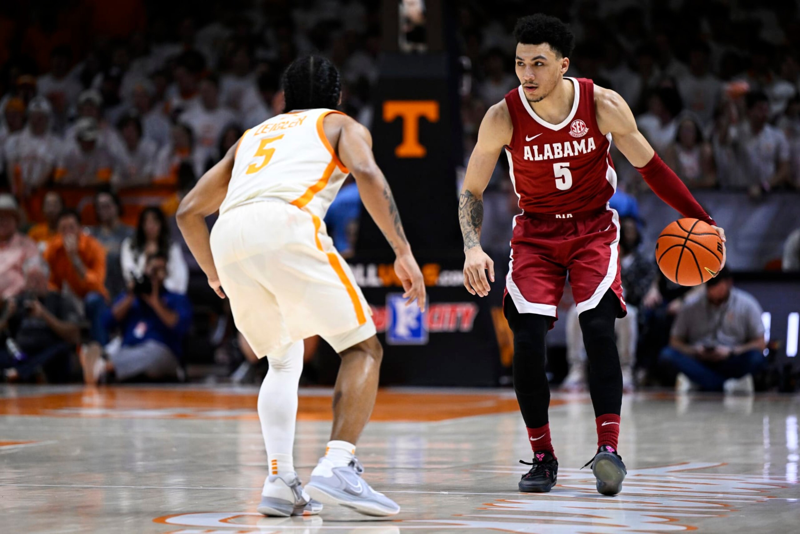 KNOXVILLE, TENNESSEE - FEBRUARY 15: Jahvon Quinerly #5 of the Alabama Crimson Tide dribbles against Zakai Zeigler #5 of the Tennessee Volunteers in the first half at Thompson-Boling Arena on February 15, 2023 in Knoxville, Tennessee. (Photo by Eakin Howard/Getty Images) KNOXVILLE, TENNESSEE - FEBRUARY 15: Jahvon Quinerly #5 of the Alabama Crimson Tide dribbles against Zakai Zeigler #5 of the Tennessee Volunteers in the first half at Thompson-Boling Arena on February 15, 2023 in Knoxville, Tennessee. (Photo by Eakin Howard/Getty Images)
