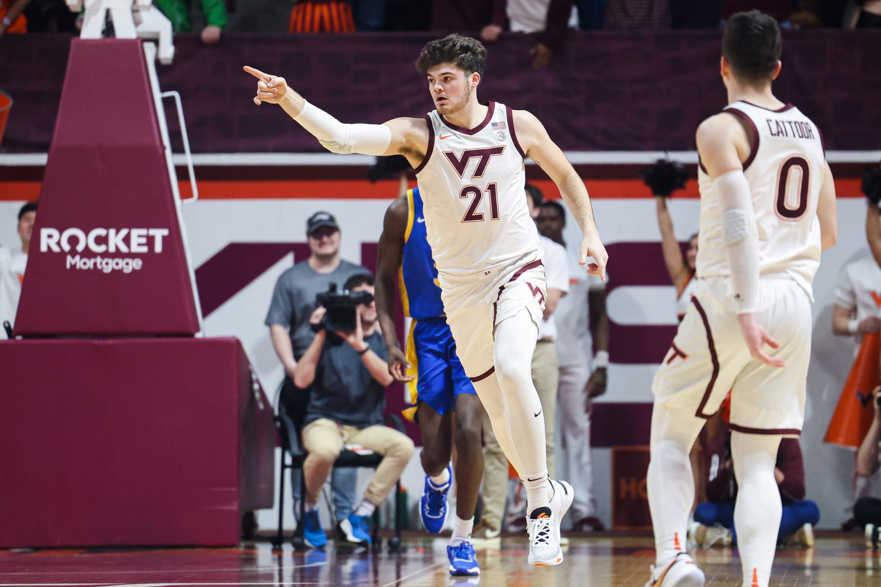 BLACKSBURG, VA - FEBRUARY 18: Grant Basile #21 of the Virginia Tech Hokies reacts in the first half during a game against the Pittsburgh Panthers at Cassell Coliseum on February 18, 2023 in Blacksburg, Virginia. (Photo by Ryan Hunt/Getty Images)