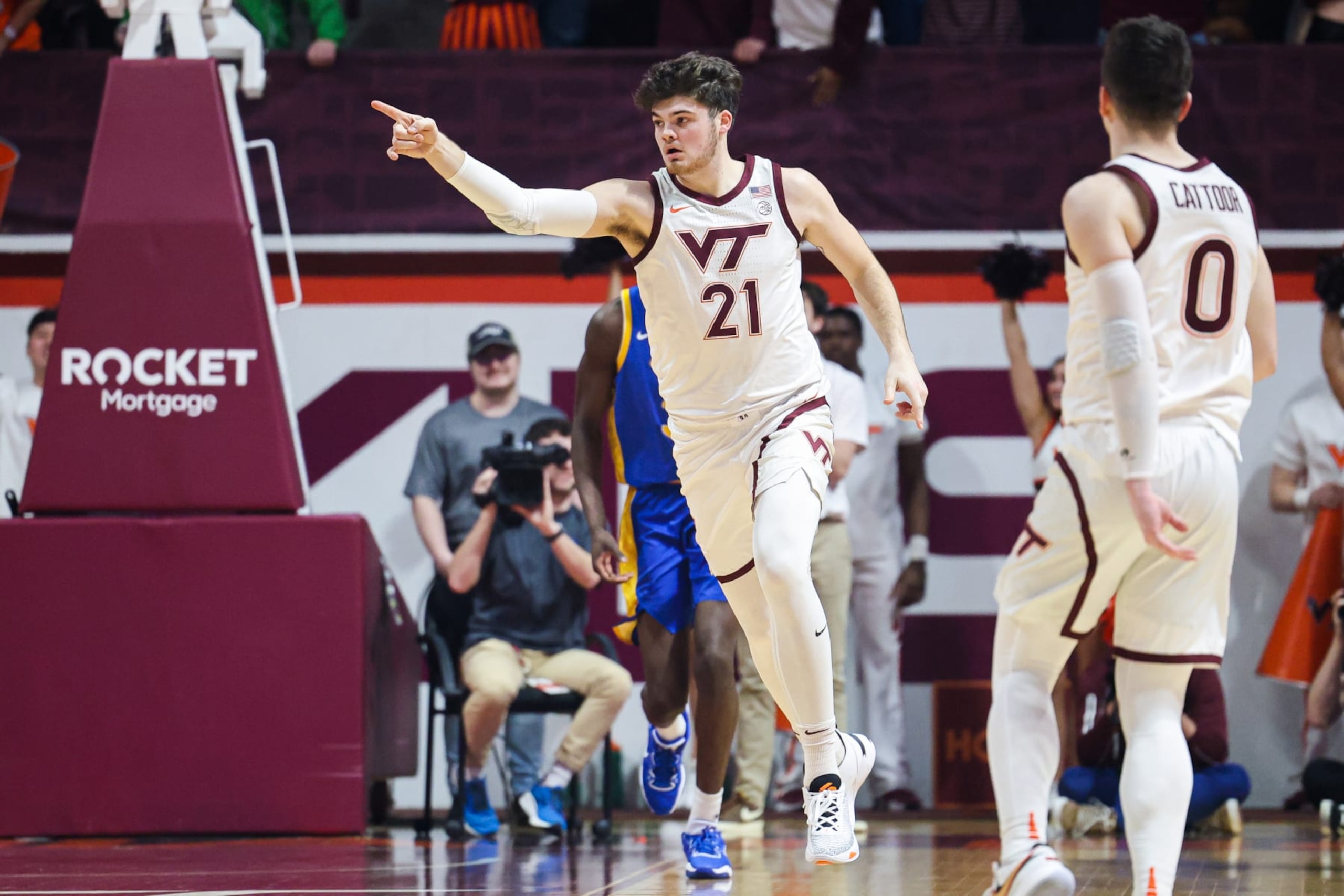 BLACKSBURG, VA - FEBRUARY 18: Grant Basile #21 of the Virginia Tech Hokies reacts in the first half during a game against the Pittsburgh Panthers at Cassell Coliseum on February 18, 2023 in Blacksburg, Virginia. (Photo by Ryan Hunt/Getty Images)