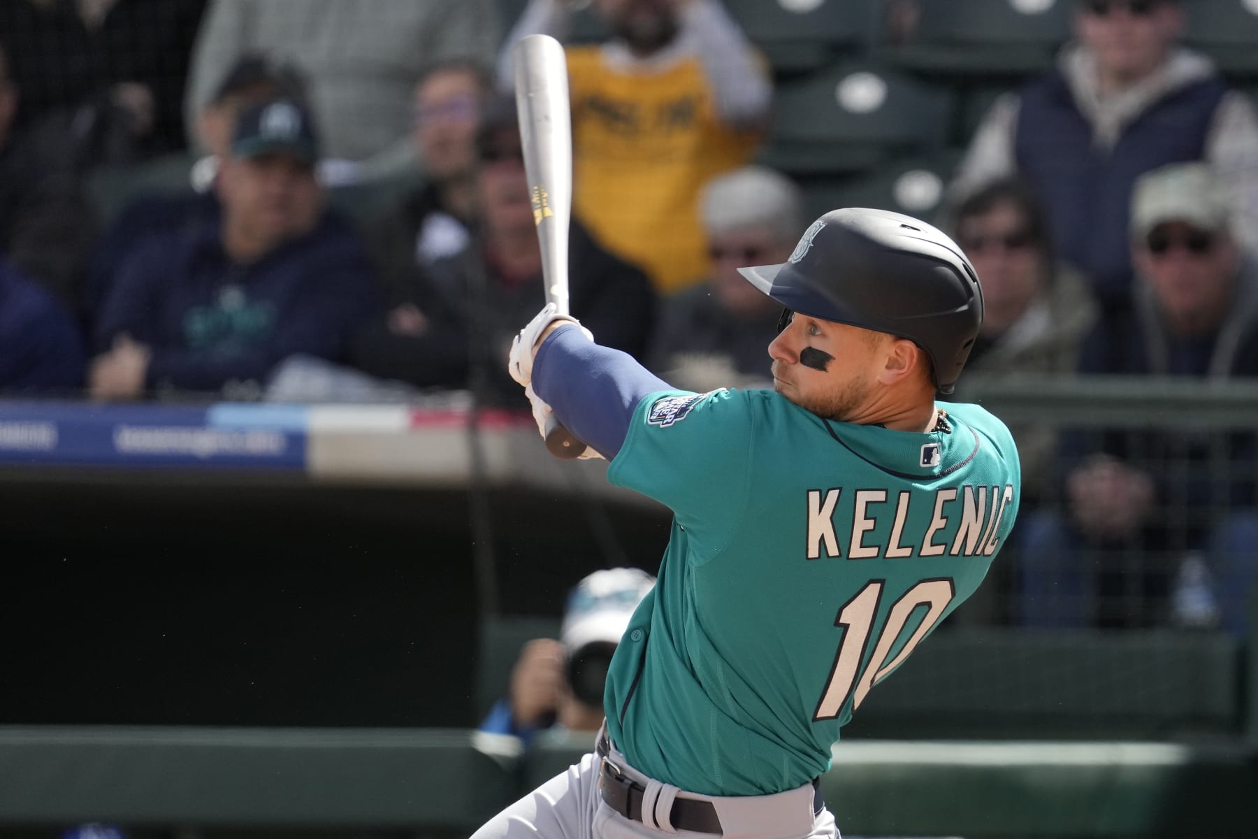 Seattle Mariners' Jarred Kelenic watches his solo home run during the second inning of a spring training baseball game against the Kansas City Royals Sunday, Feb. 26, 2023, in Surprise, Ariz. (AP Photo/Charlie Riedel)