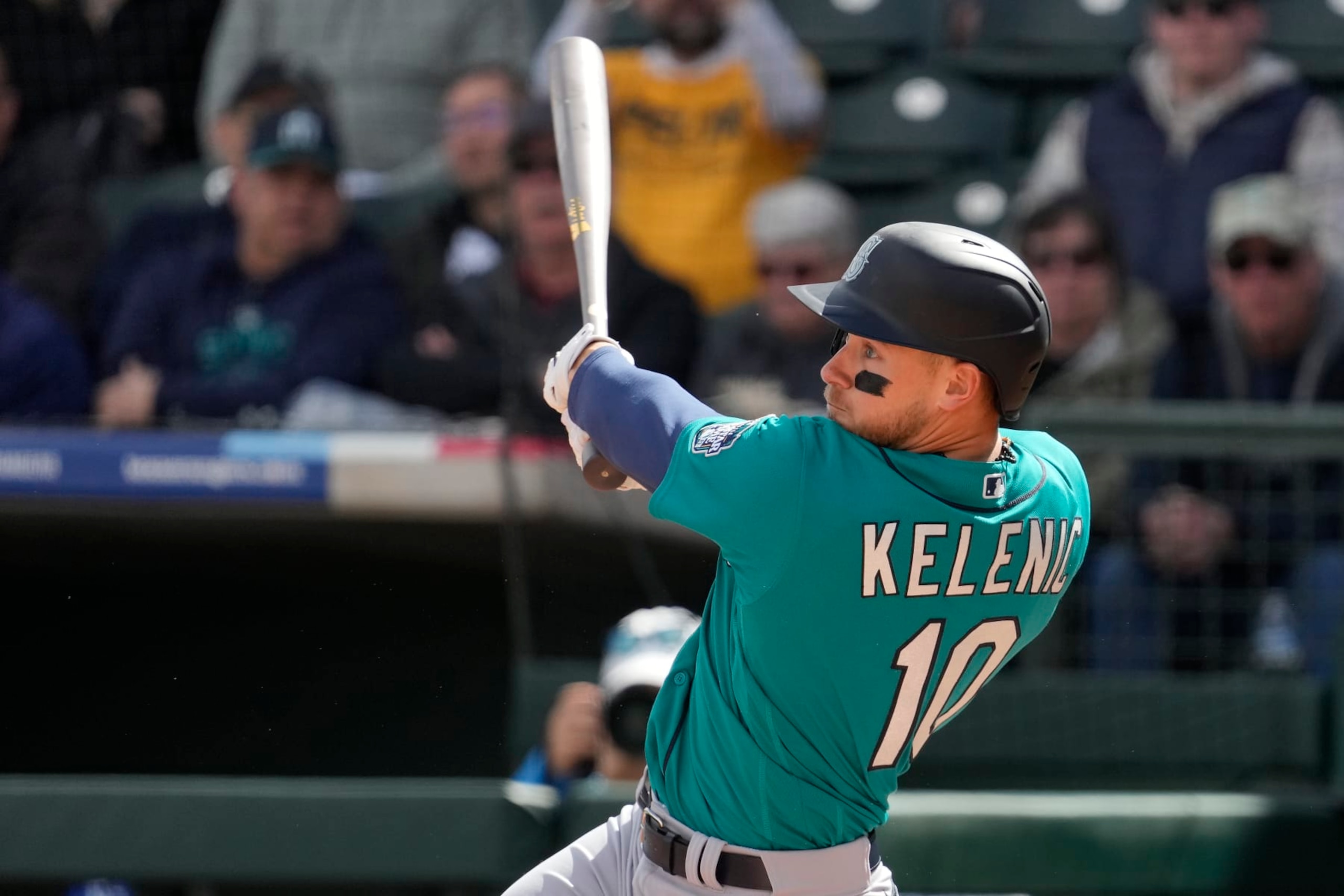 Seattle Mariners' Jarred Kelenic watches his solo home run during the second inning of a spring training baseball game against the Kansas City Royals Sunday, Feb. 26, 2023, in Surprise, Ariz. (AP Photo/Charlie Riedel)
