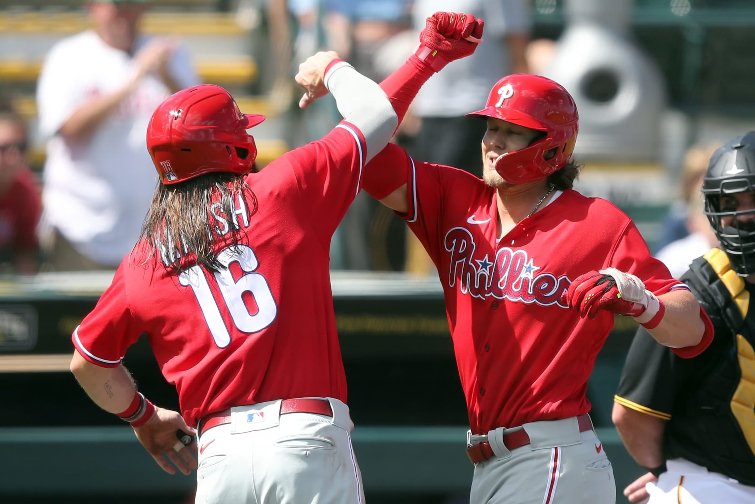BRADENTON, FL - FEBRUARY 27: Philadelphia Phillies Outfielder Brandon Marsh (16) congratulates third baseman Alec Bohm (28) on his home run during the spring training game between the Philadelphia Phillies and the Pittsburgh Pirates on February 27, 2023, at LECOM Park in Bradenton, FL. (Photo by Cliff Welch/Icon Sportswire via Getty Images)