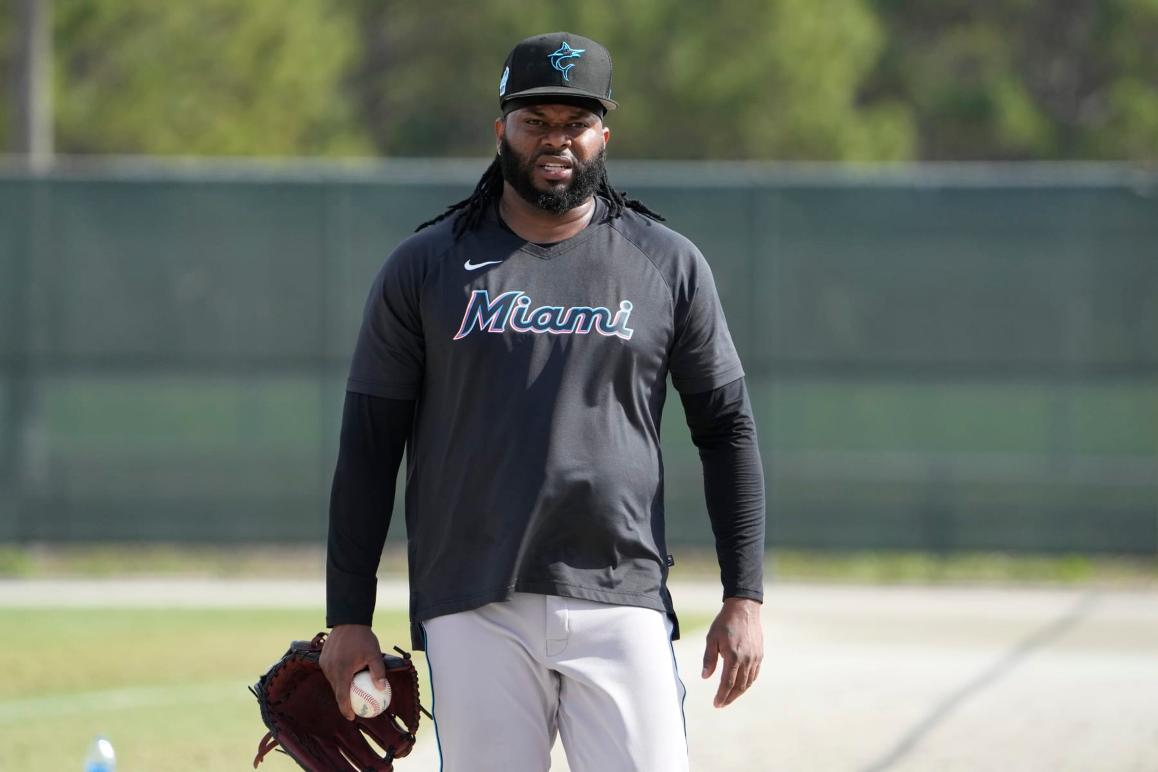 Miami Marlins pitcher Johnny Cueto walks between fields during spring training baseball practice Sunday, Feb. 19, 2023, in Jupiter, Fla. (AP Photo/Jeff Roberson)