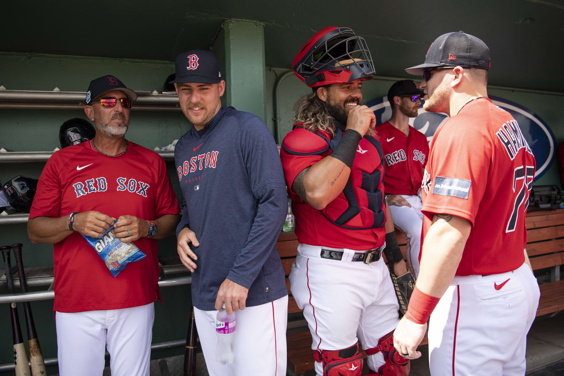 FORT MYERS, FL - MARCH 6:  José Flores, Josh Winckowski #73 of the Boston Red Sox, Jorge Alfaro #38 of the Boston Red Sox, and Caleb Hamilton #77 of the Boston Red Sox react in the dugout before a Grapefruit League game against the Detroit Tigers on March 6, 2023 at JetBlue Park at Fenway South in Fort Myers, Florida. (Photo by Maddie Malhotra/Boston Red Sox/Getty Images)
