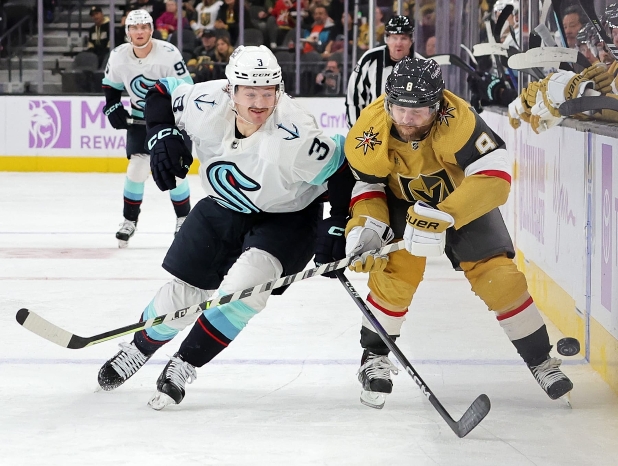 LAS VEGAS, NEVADA - NOVEMBER 25: Will Borgen #3 of the Seattle Kraken and Phil Kessel #8 of the Vegas Golden Knights vie for the puck in the second period of their game at T-Mobile Arena on November 25, 2022 in Las Vegas, Nevada. The Kraken defeated the Golden Knights 4-2. (Photo by Ethan Miller/Getty Images)