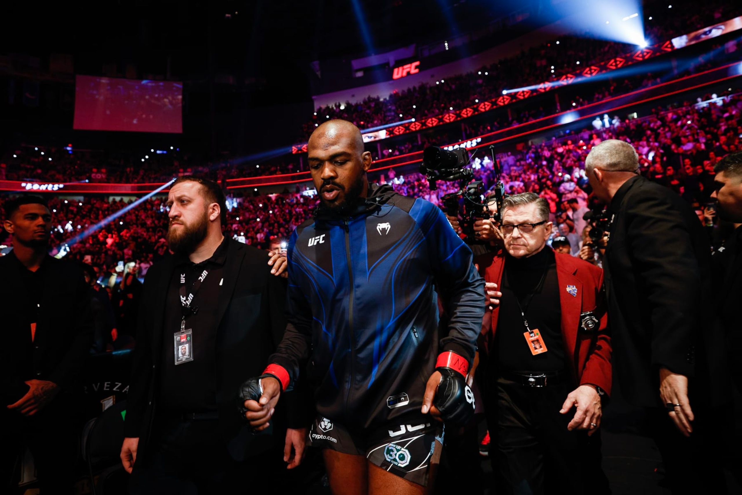 LAS VEGAS, NEVADA - MARCH 04: Jon Jones enters the arena for the UFC heavyweight championship fight against Ciryl Gane of France during the UFC 285 event at T-Mobile Arena on March 04, 2023 in Las Vegas, Nevada. (Photo by Chris Graythen/Getty Images)