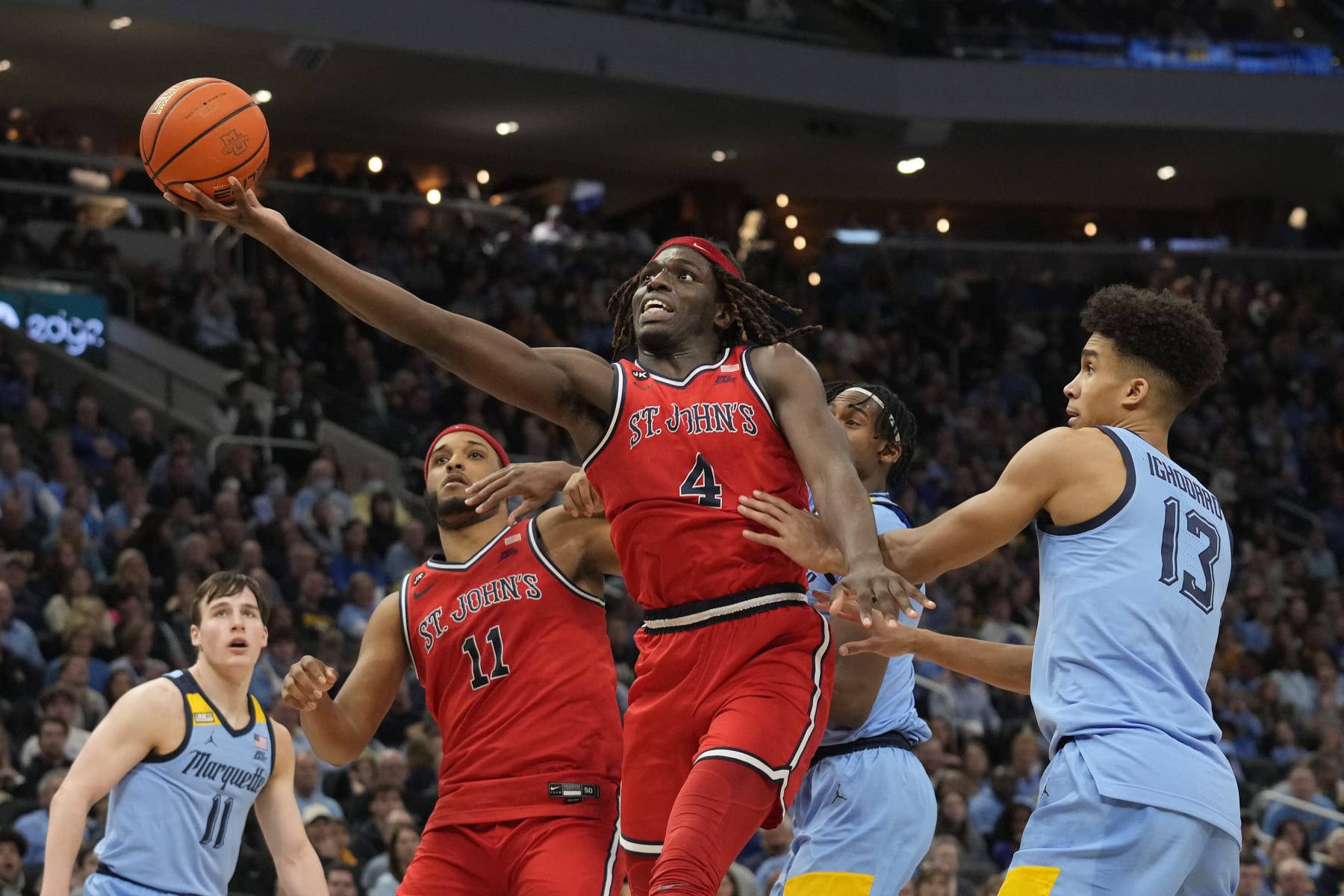 MILWAUKEE, WISCONSIN - MARCH 04: O'Mar Stanley #4 of the St. John's Red Storm shoots the ball against Oso Ighodaro #13 of the Marquette Golden Eagles in the second half at Fiserv Forum on March 04, 2023 in Milwaukee, Wisconsin. (Photo by Patrick McDermott/Getty Images)
