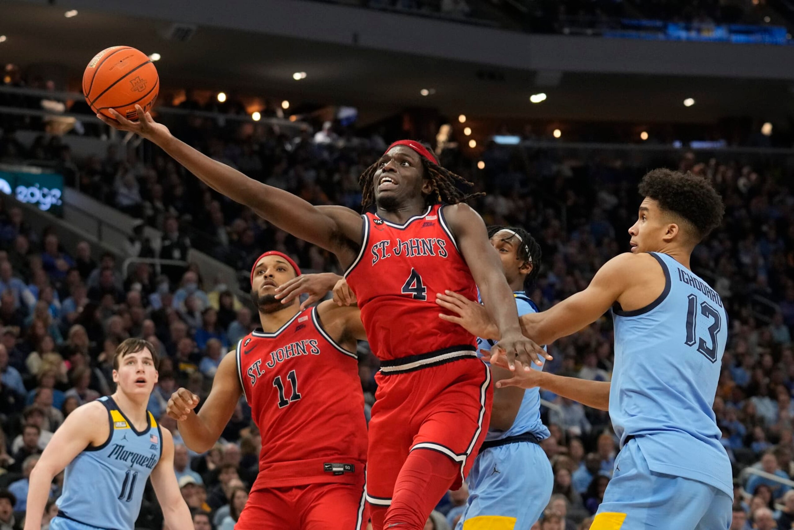 MILWAUKEE, WISCONSIN - MARCH 04: O'Mar Stanley #4 of the St. John's Red Storm shoots the ball against Oso Ighodaro #13 of the Marquette Golden Eagles in the second half at Fiserv Forum on March 04, 2023 in Milwaukee, Wisconsin. (Photo by Patrick McDermott/Getty Images)