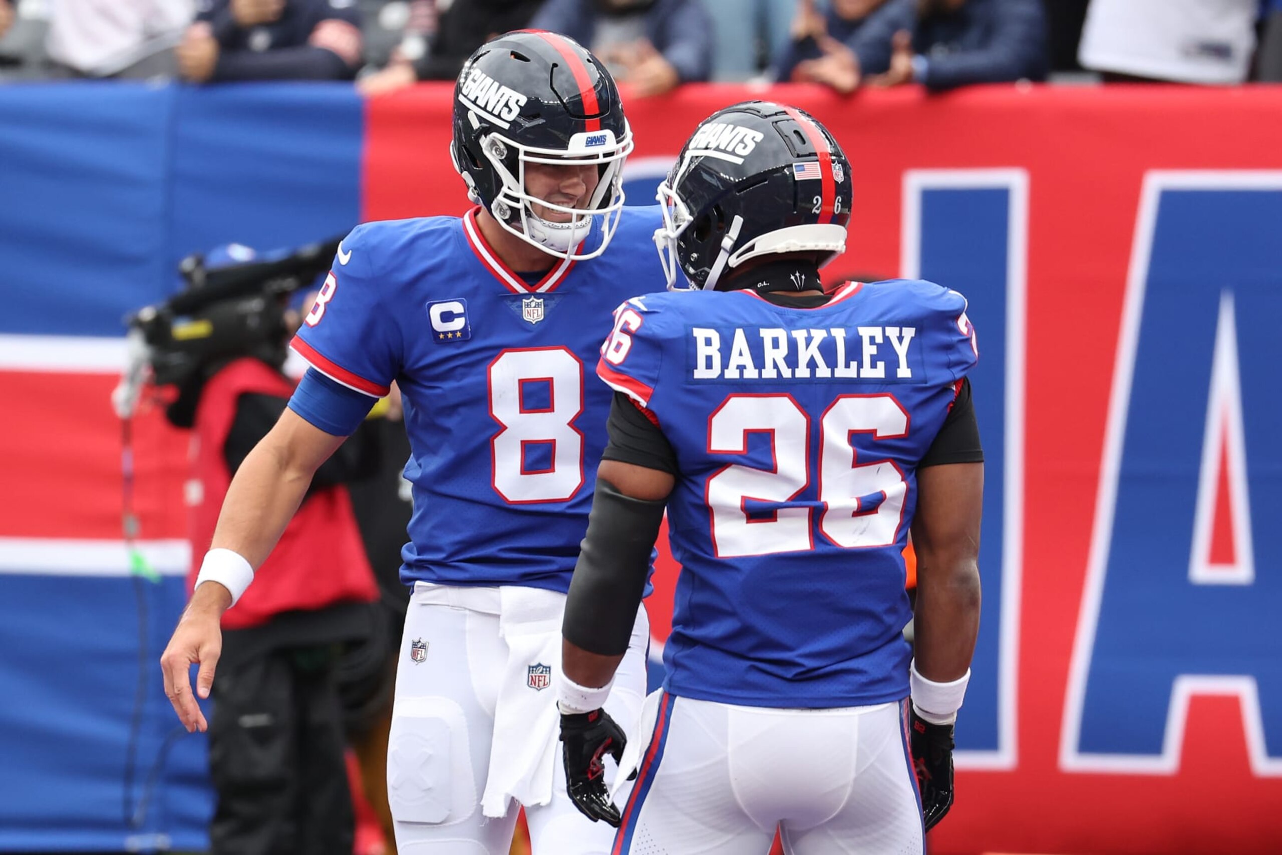 EAST RUTHERFORD, NEW JERSEY - OCTOBER 02: Daniel Jones #8 of the New York Giants celebrates his touchdown with Saquon Barkley #26 of the New York Giants in the first half of the game against the Chicago Bears at MetLife Stadium on October 02, 2022 in East Rutherford, New Jersey. (Photo by Al Bello/Getty Images)