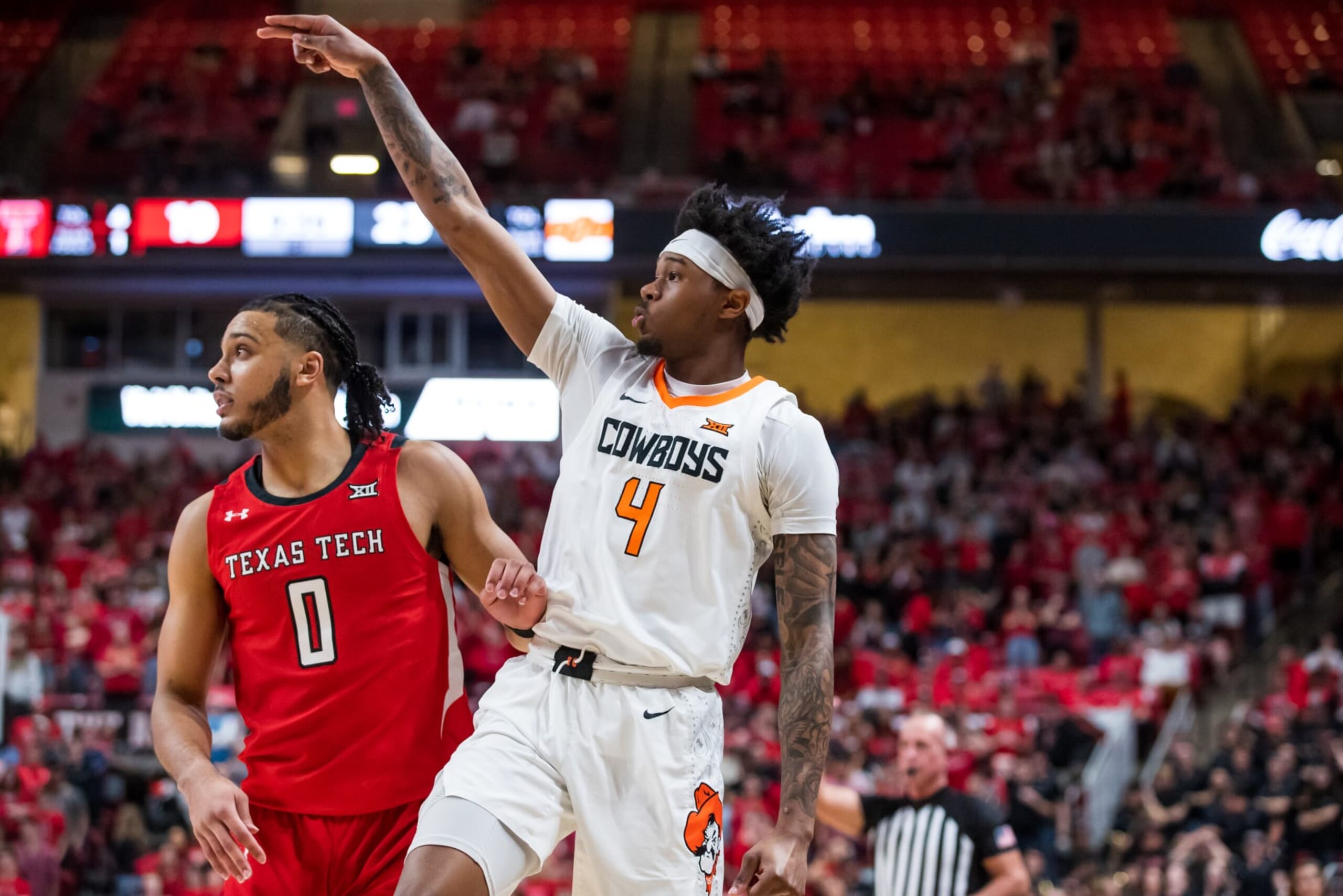 LUBBOCK, TEXAS - MARCH 04: Guard Woody Newton #4 of the Oklahoma State Cowboys shoots the ball during the first half of the college basketball game against the Texas Tech Red Raiders at United Supermarkets Arena on March 04, 2023 in Lubbock, Texas. (Photo by John E. Moore III/Getty Images)