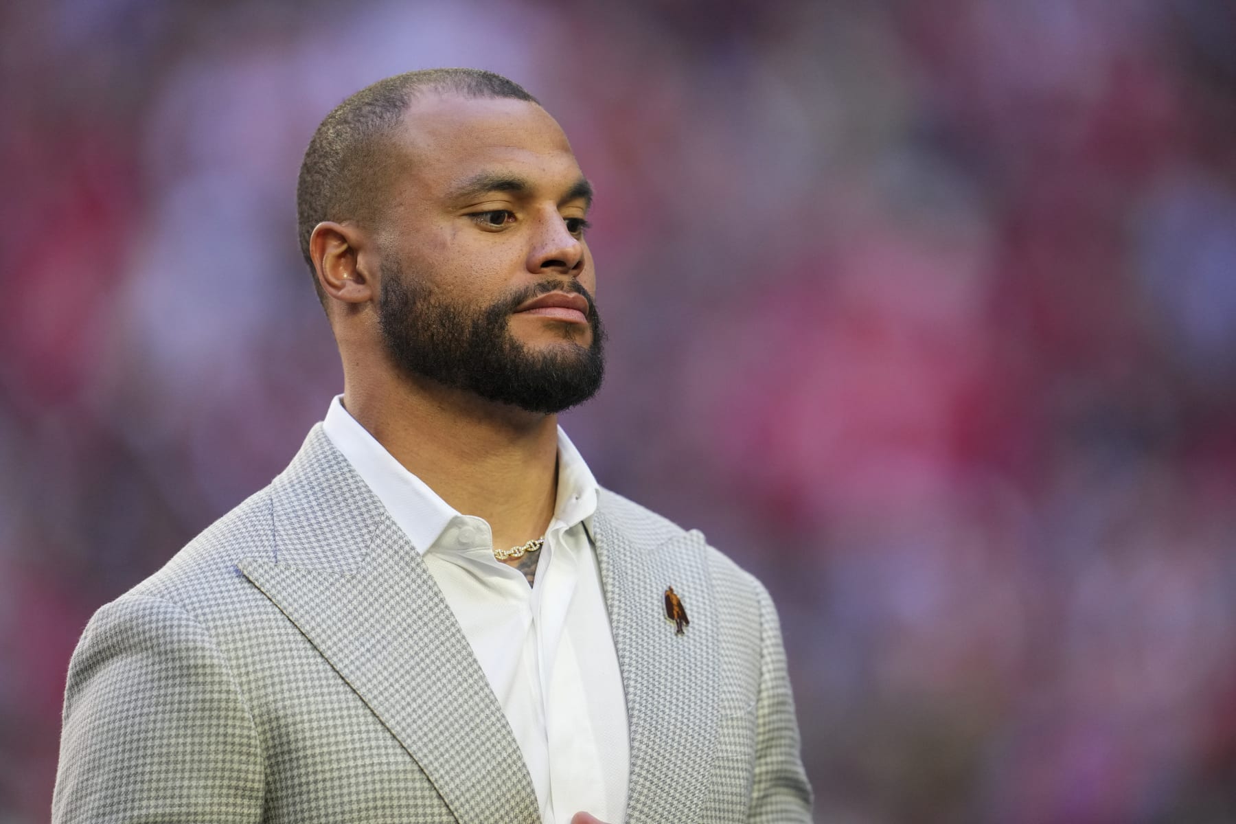 GLENDALE, AZ - FEBRUARY 12: Dak Prescott stands on field during the Walter Payton Man of the Year presentation after Super Bowl LVII at State Farm Stadium on February 12, 2023 in Glendale, Arizona. The Chiefs defeated the Eagles 38-35. (Photo by Cooper Neill/Getty Images)