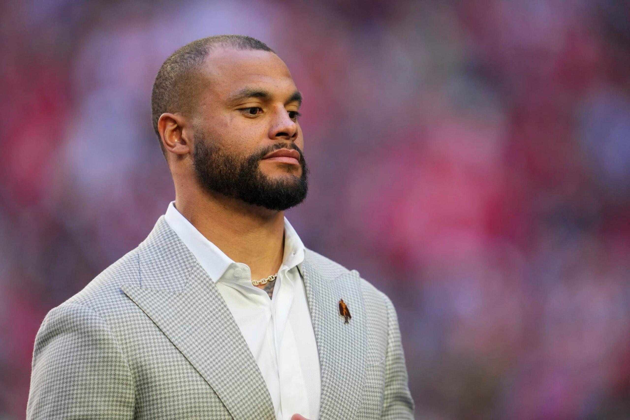 GLENDALE, AZ - FEBRUARY 12: Dak Prescott stands on field during the Walter Payton Man of the Year presentation after Super Bowl LVII at State Farm Stadium on February 12, 2023 in Glendale, Arizona. The Chiefs defeated the Eagles 38-35. (Photo by Cooper Neill/Getty Images)