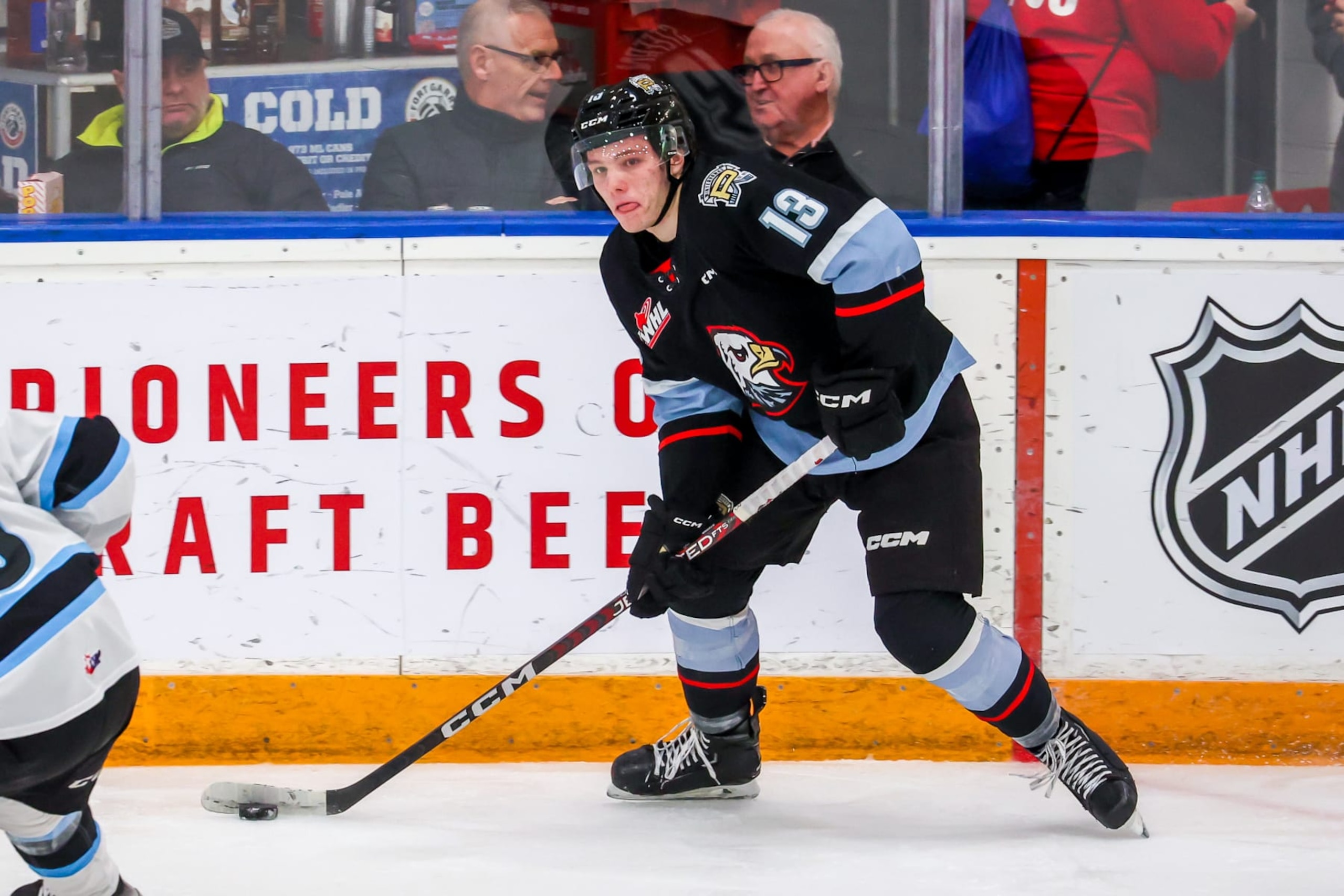 WINNIPEG, CANADA - JANUARY 08: James Stefan #13 of the Portland Winterhawks plays the puck during second period action against the Winnipeg ICE at Wayne Fleming Arena on January 08, 2023 in Winnipeg, Manitoba, Canada. (Photo by Jonathan Kozub/Getty Images)