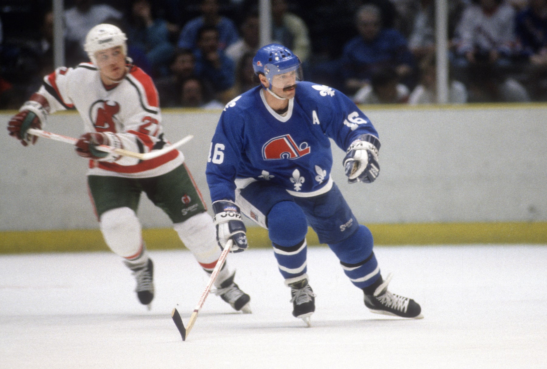 EAST RUTHERFORD, NJ - CIRCA 1989:  Michael Goulet #16 of the Quebec Nordiques skates against the New Jersey Devils during an NHL Hockey game circa 1989 at the Brendan Byrne Arena in East Rutherford, New Jersey. Goulet's playing career went from 1978-94. (Photo by Focus on Sport/Getty Images)