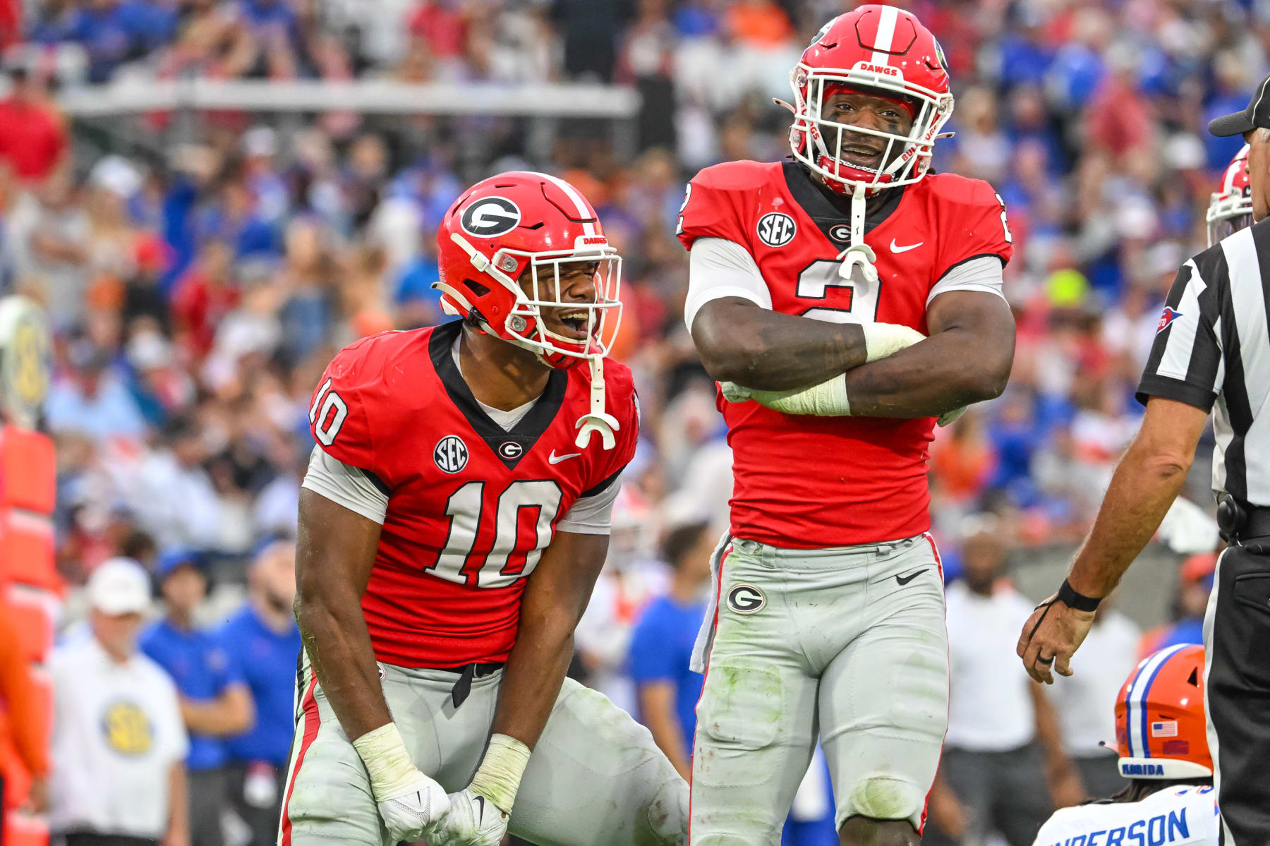 JACKSONVILLE, FL - OCTOBER 29: Georgia Bulldogs linebacker Jamon Dumas-Johnson (10) and Georgia Bulldogs linebacker Smael Mondon Jr. (2) celebrate a big defensive play during the college football game between the Florida Gators and Georgia Bulldogs on October 29, 2022, at TIAA Bank Field in Jacksonville, Florida. (Photo by John Adams/Icon Sportswire via Getty Images)