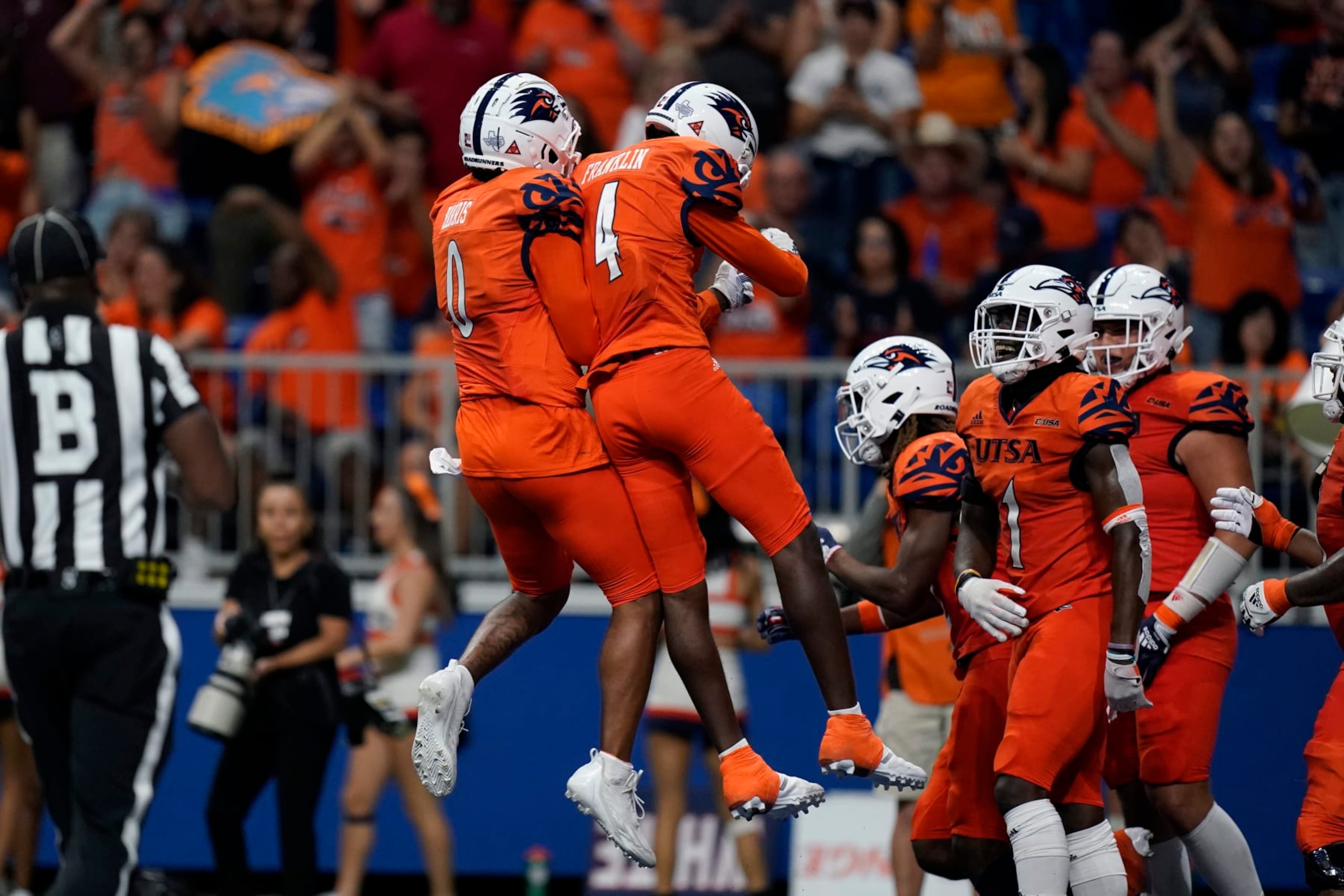 UTSA quarterback Frank Harris (0) and wide receiver Zakhari Franklin (4) celebrate after they connected on a touchdown pass against Texas Southern during the second half of an NCAA college football game, Saturday, Sept. 24, 2022, in San Antonio. (AP Photo/Eric Gay)