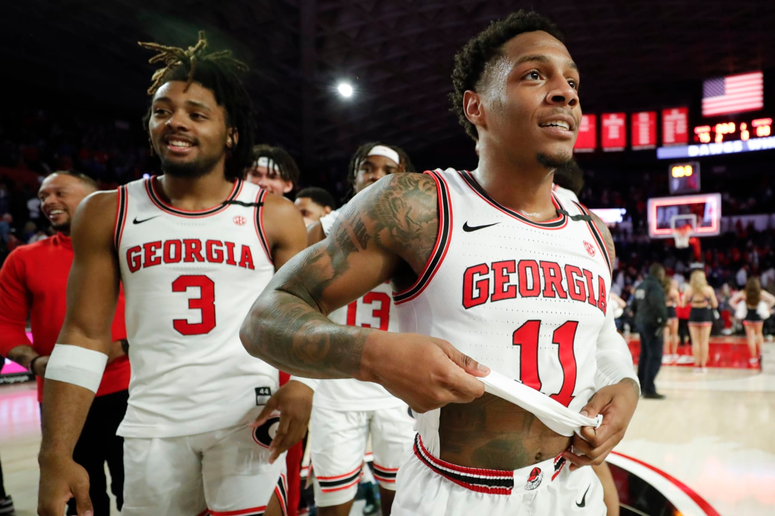 Georgia's Kario Oquendo, left, and Justin Hill, right, leave the court after an NCAA college basketball game against Kentucky, Saturday, Feb. 11, 2023, in Athens, Ga. (AP Photo/Alex Slitz) Georgia's Kario Oquendo, left, and Justin Hill, right, leave the court after an NCAA college basketball game against Kentucky, Saturday, Feb. 11, 2023, in Athens, Ga. (AP Photo/Alex Slitz)