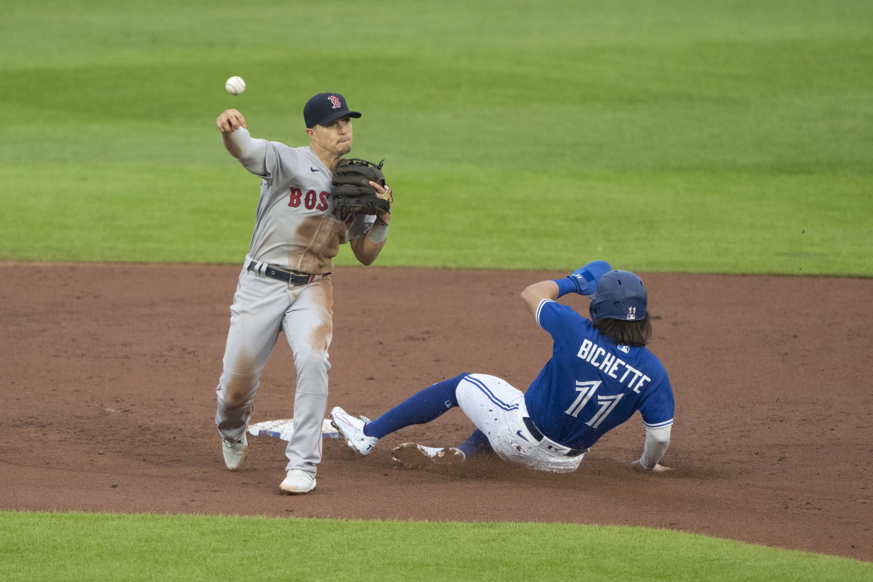 BUFFALO, NY - JULY 19: Boston Red Sox Second Baseman Enrique Hernandez (5) turns a double play with Toronto Blue Jays Shortstop Bo Bichette (11) sliding into second base during the first inning of a Major League Baseball game between the Boston Red Sox and the Toronto Blue Jays on July 19, 2021, at Sahlen Field in Buffalo, NY. (Photo by Gregory Fisher/Icon Sportswire via Getty Images)