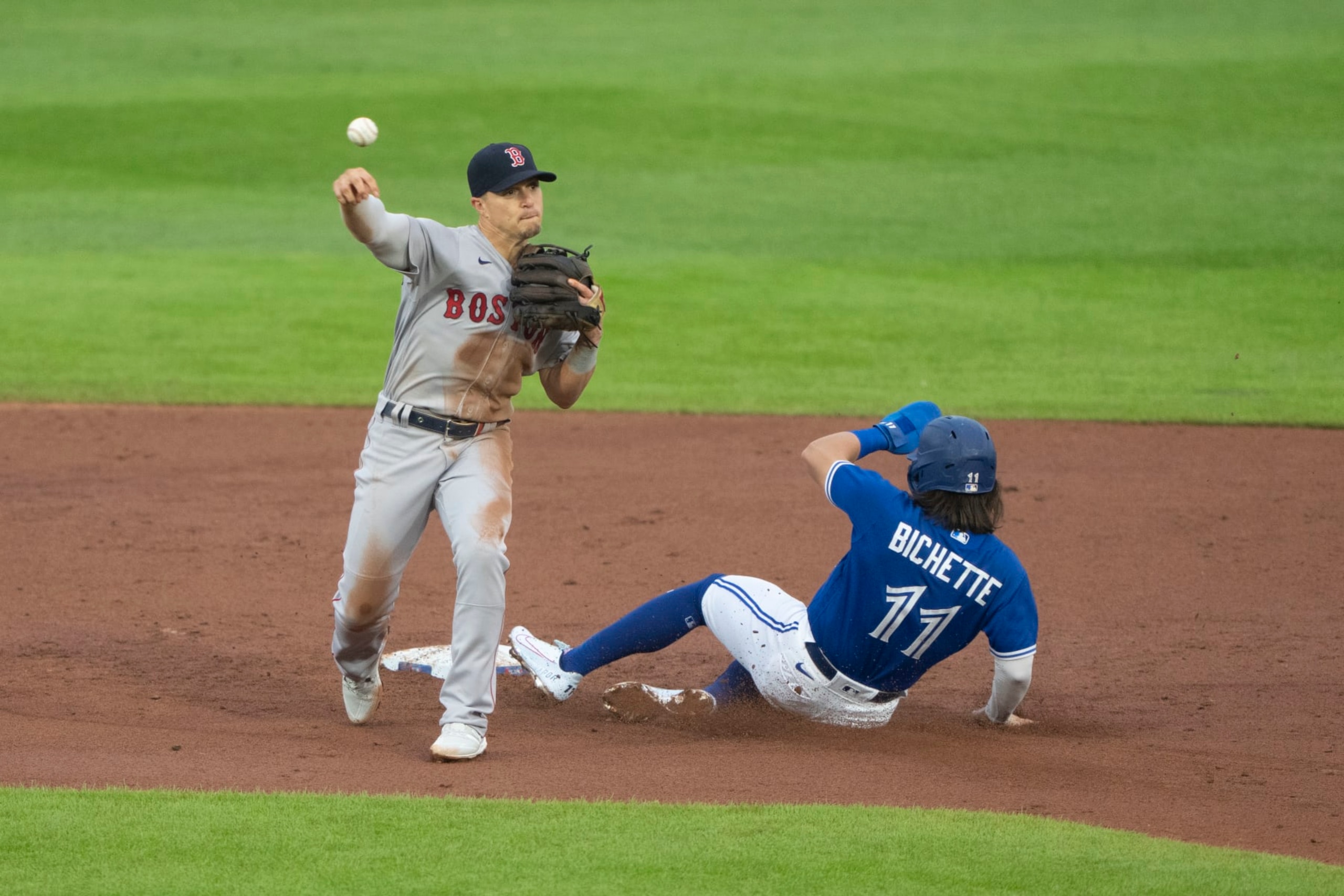 BUFFALO, NY - JULY 19: Boston Red Sox Second Baseman Enrique Hernandez (5) turns a double play with Toronto Blue Jays Shortstop Bo Bichette (11) sliding into second base during the first inning of a Major League Baseball game between the Boston Red Sox and the Toronto Blue Jays on July 19, 2021, at Sahlen Field in Buffalo, NY. (Photo by Gregory Fisher/Icon Sportswire via Getty Images)
