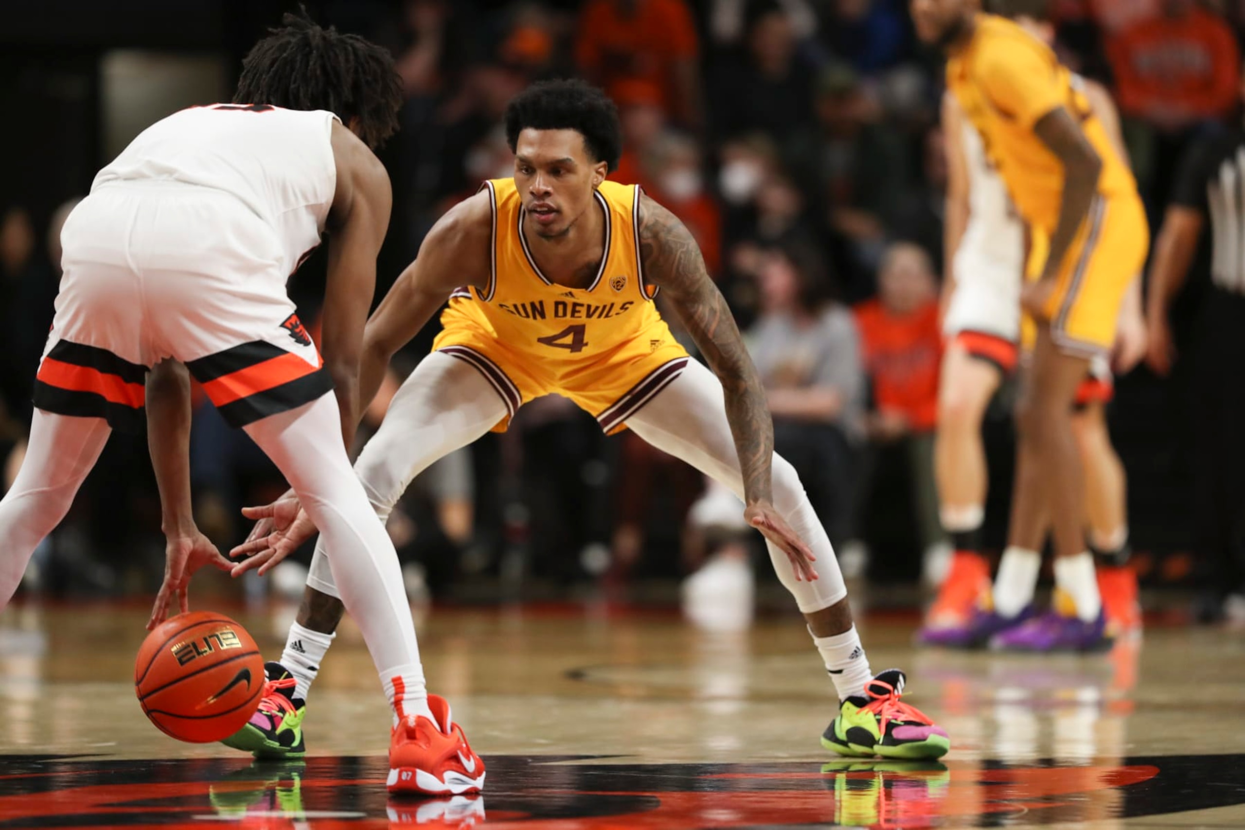 Arizona State guard Desmond Cambridge Jr. (4) guards Oregon State forward Glenn Taylor Jr. (35) during the second half of an NCAA college basketball game in Corvallis, Ore., Saturday, Jan. 14, 2023. Arizona State won 74-69. (AP Photo/Amanda Loman)