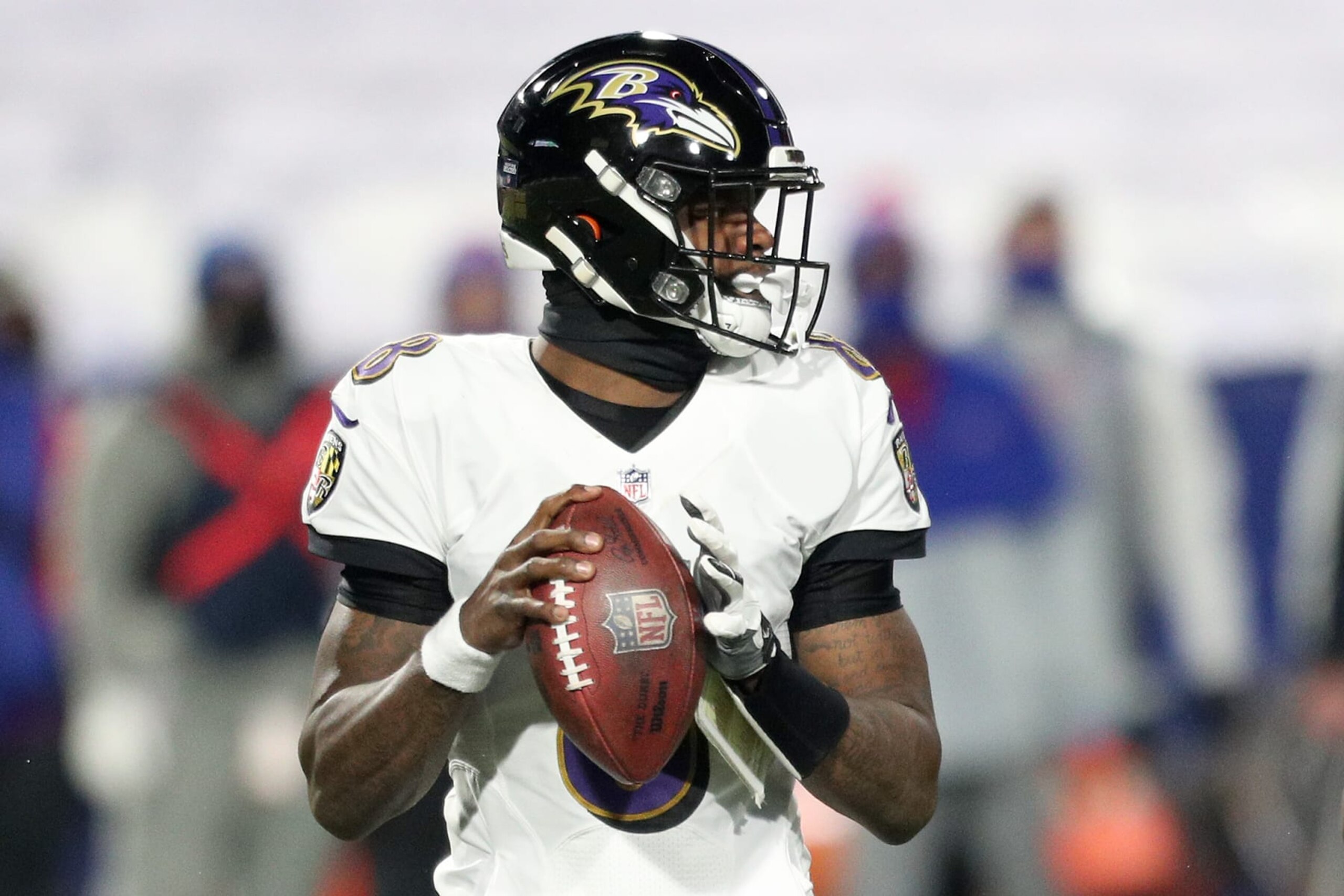 ORCHARD PARK, NEW YORK - JANUARY 16: Lamar Jackson #8 of the Baltimore Ravens looks to pass in the first quarter against the Buffalo Bills during the AFC Divisional Playoff game at Bills Stadium on January 16, 2021 in Orchard Park, New York. (Photo by Bryan M. Bennett/Getty Images)