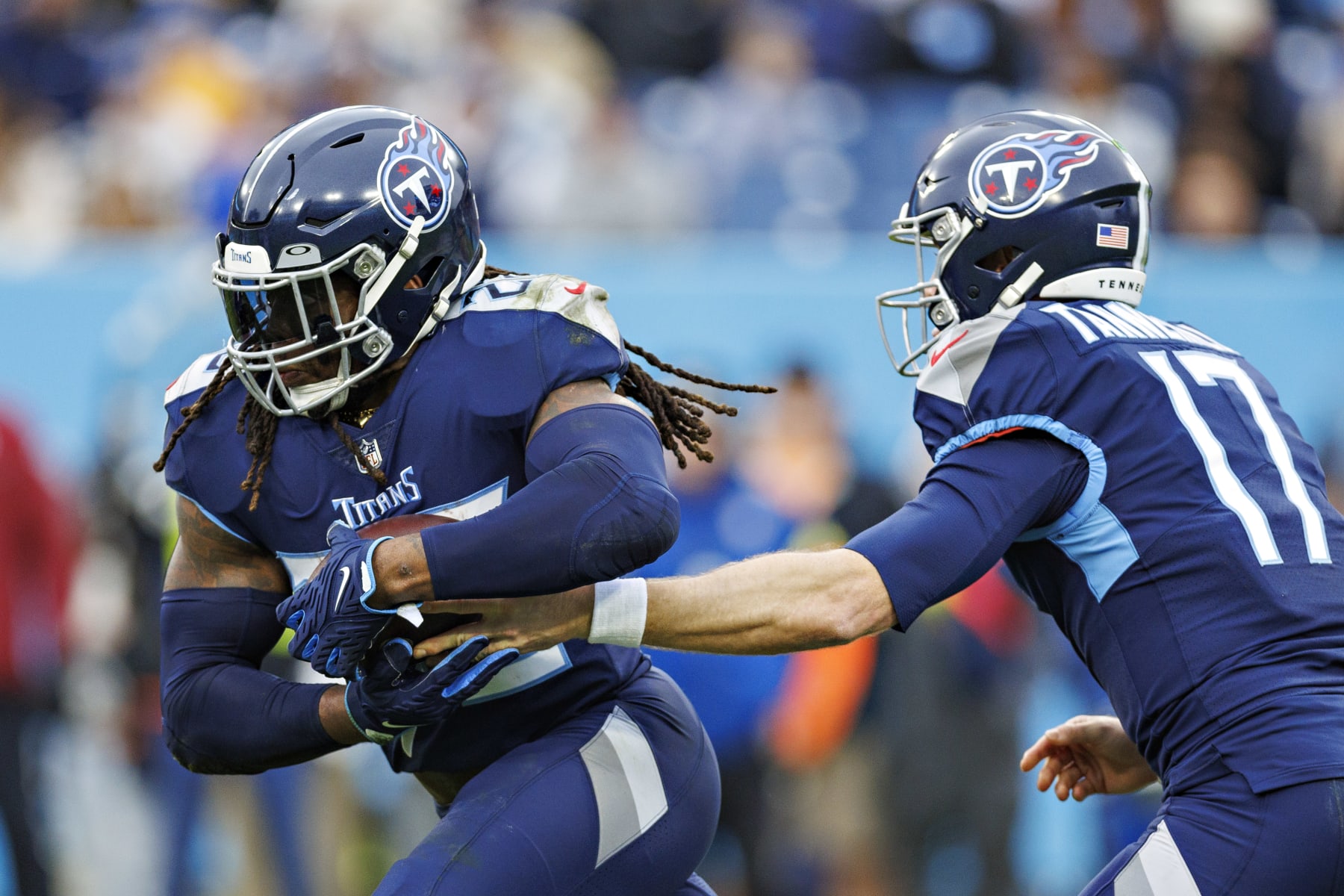 NASHVILLE, TENNESSEE - DECEMBER 11: Ryan Tannehill #17 hands off the ball to Derrick Henry #22 of the Tennessee Titans during a game against the Jacksonville Jaguars at Nissan Stadium on December 11, 2022 in Nashville, Tennessee. The Jaguars defeated the Titans. The Jaguars defeated the Titans 36-22.  (Photo by Wesley Hitt/Getty Images)