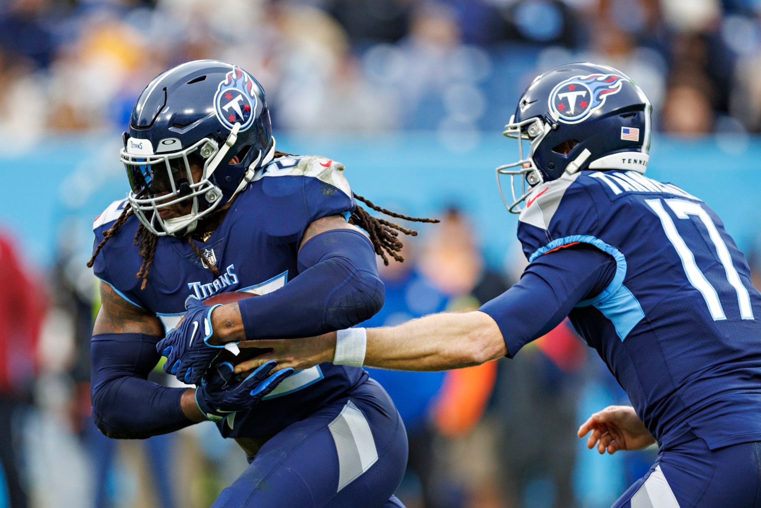 NASHVILLE, TENNESSEE - DECEMBER 11: Ryan Tannehill #17 hands off the ball to Derrick Henry #22 of the Tennessee Titans during a game against the Jacksonville Jaguars at Nissan Stadium on December 11, 2022 in Nashville, Tennessee. The Jaguars defeated the Titans. The Jaguars defeated the Titans 36-22.  (Photo by Wesley Hitt/Getty Images)