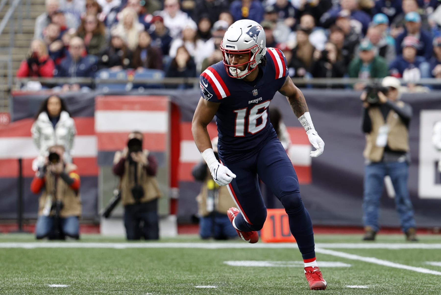 FOXBOROUGH, MA - JANUARY 01: New England Patriots wide receiver Jakobi Meyers (16) goes in motion on a trick play during a game between the New England Patriots and the Miami Dolphins on January 1, 2023, at Gillette Stadium in Foxboro, Massachusetts. (Photo by Fred Kfoury III/Icon Sportswire via Getty Images)