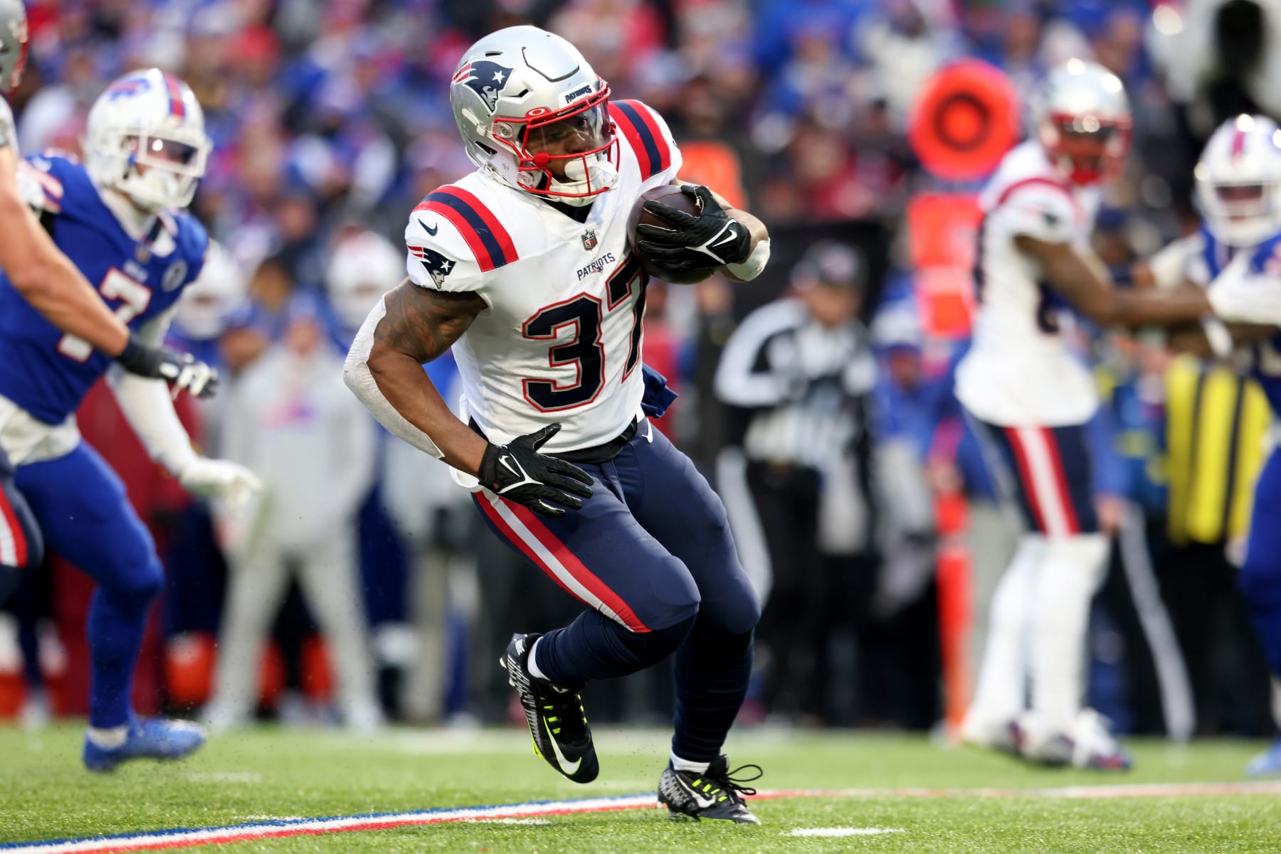 ORCHARD PARK, NEW YORK - JANUARY 08: Damien Harris #37 of the New England Patriots runs the ball during the fourth quarter against the Buffalo Bills at Highmark Stadium on January 08, 2023 in Orchard Park, New York. (Photo by Bryan Bennett/Getty Images)