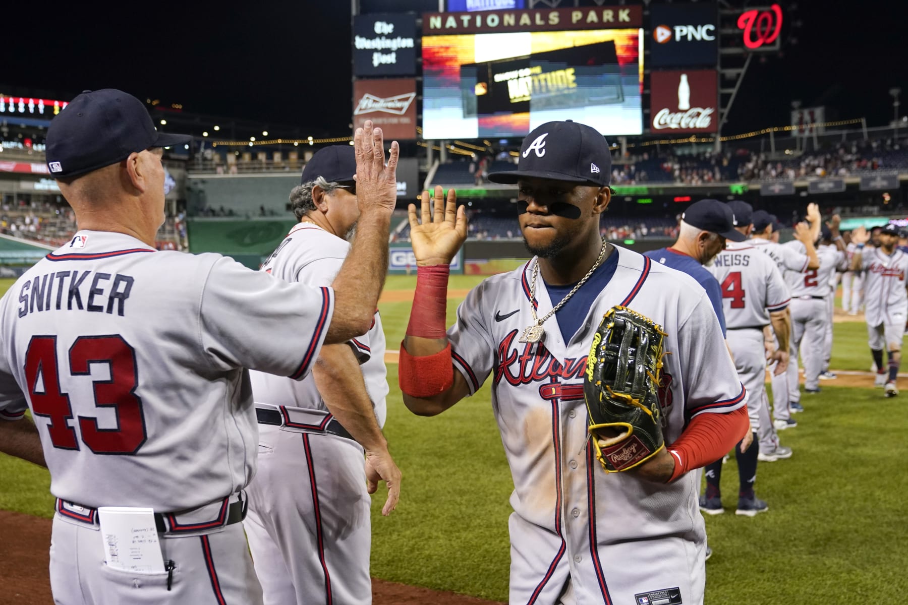 Brian Snitker (L) and Ronald Acuña Jr. (R), Atlanta