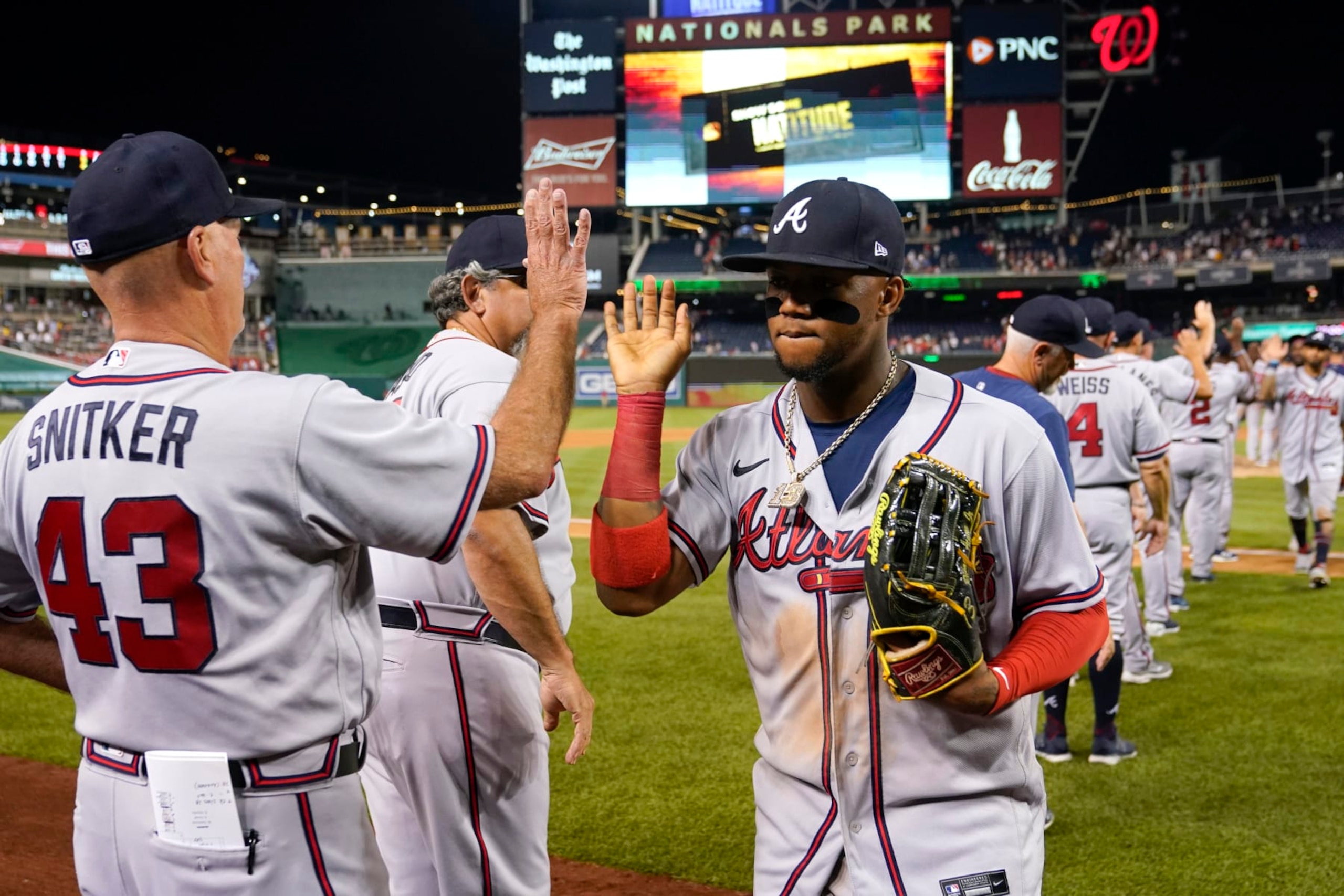 Brian Snitker (L) and Ronald Acuña Jr. (R), Atlanta