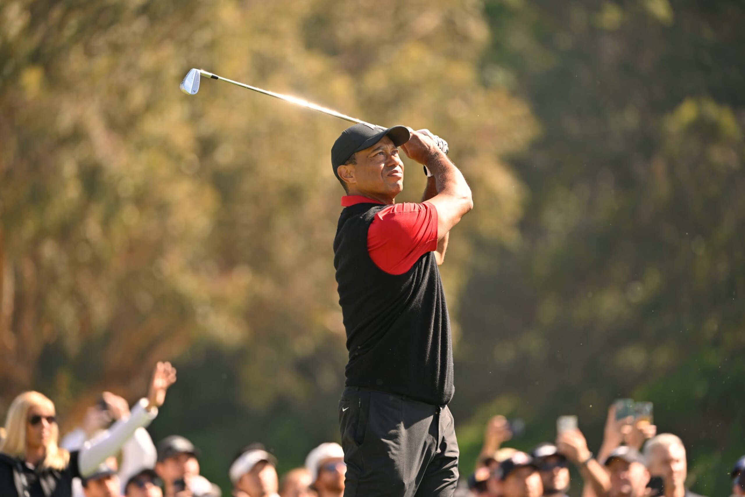 PACIFIC PALISADES, CALIFORNIA - FEBRUARY 19: Tiger Woods hits a shot on the 16th hole during the final round of The Genesis Invitational at Riviera Country Club on February 19, 2023 in Pacific Palisades, California. (Photo by Ben Jared/PGA TOUR via Getty Images)