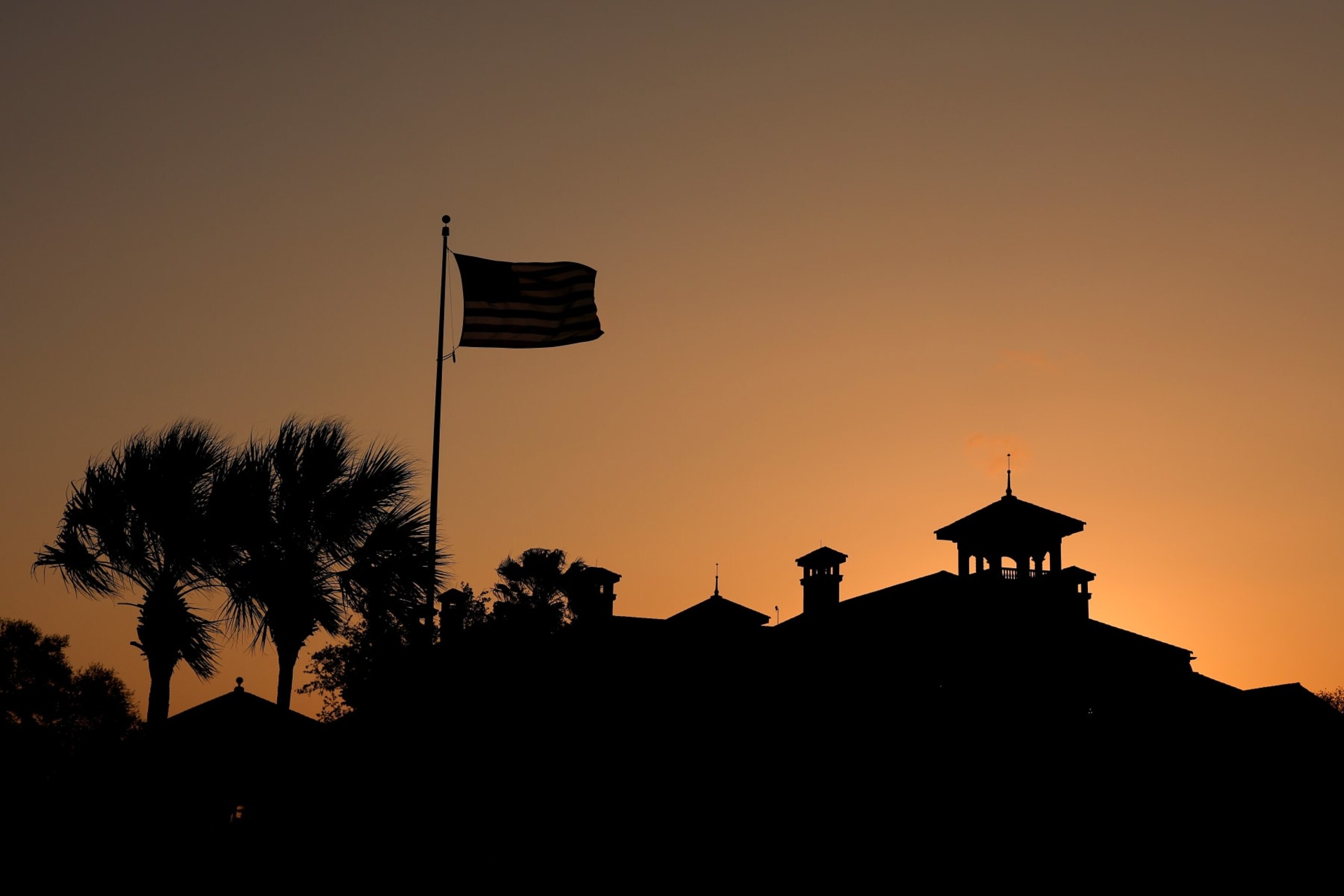 PONTE VEDRA BEACH, FLORIDA - MARCH 08: An American flag blows in the breeze as the clubhouse is seen during a practice round prior to THE PLAYERS Championship on THE PLAYERS Stadium Course at TPC Sawgrass on March 08, 2023 in Ponte Vedra Beach, Florida. (Photo by Richard Heathcote/Getty Images)