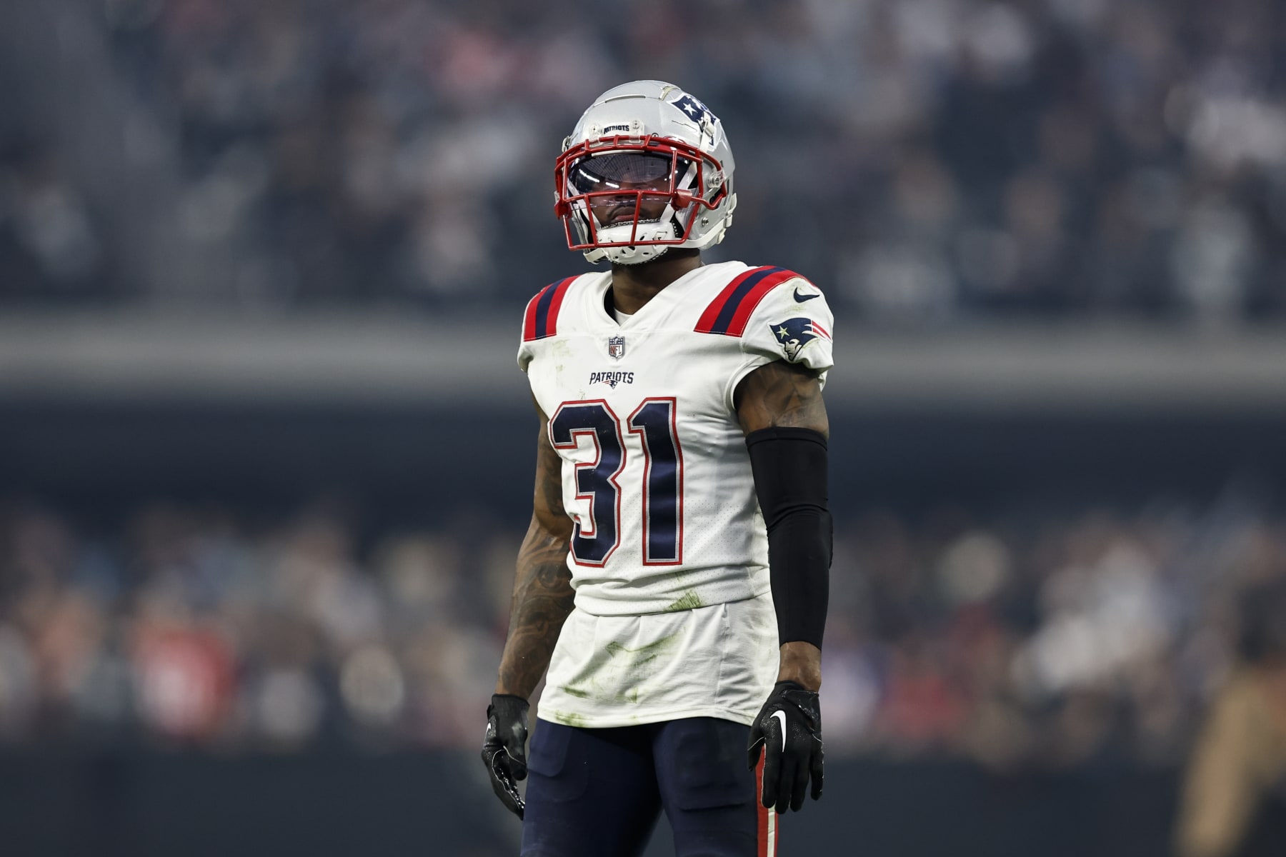 LAS VEGAS, NEVADA - DECEMBER 18: Jonathan Jones #31 of the New England Patriots looks on during an NFL football game between the Las Vegas Raiders and the New England Patriots at Allegiant Stadium on December 18, 2022 in Las Vegas, Nevada. (Photo by Michael Owens/Getty Images)