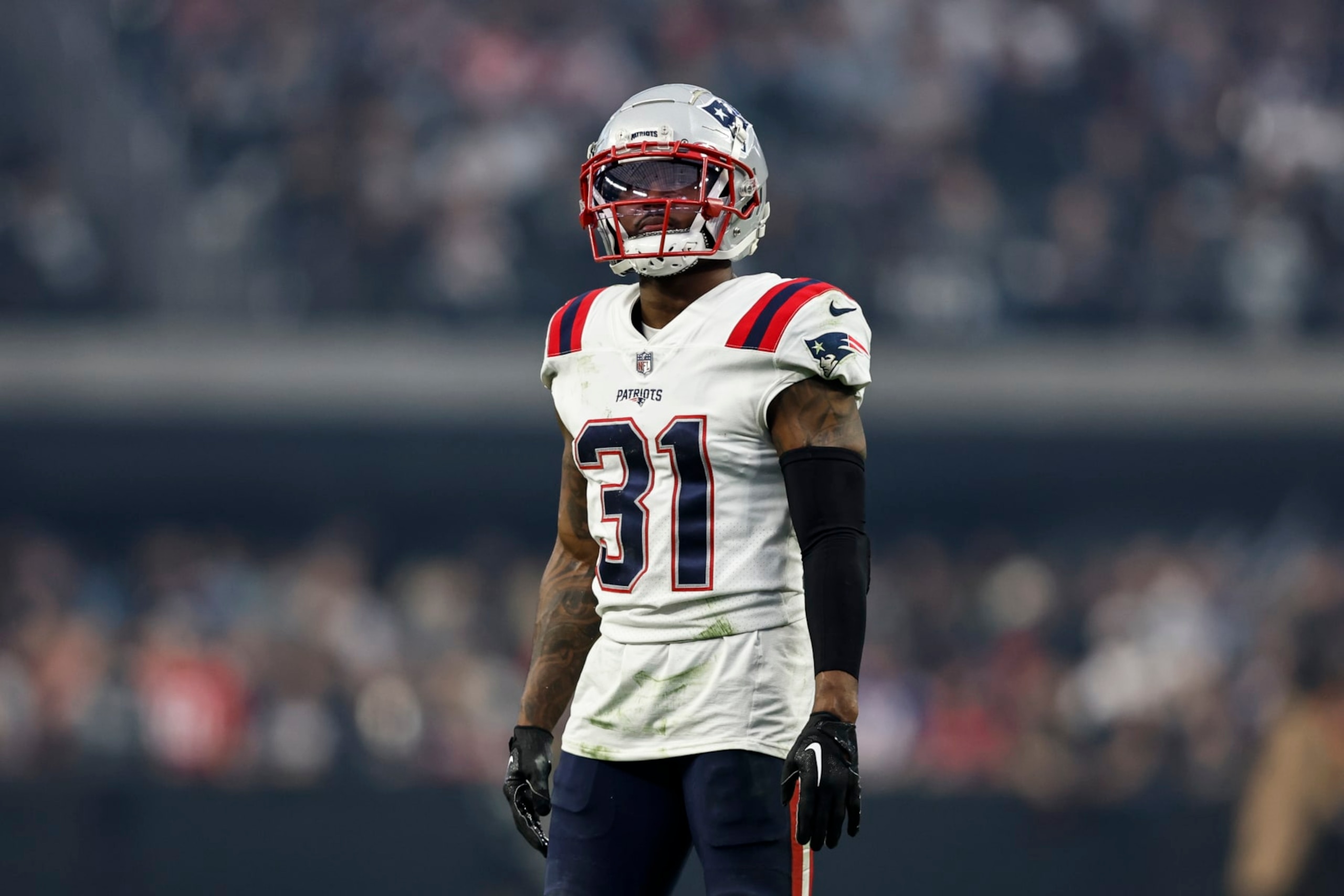 LAS VEGAS, NEVADA - DECEMBER 18: Jonathan Jones #31 of the New England Patriots looks on during an NFL football game between the Las Vegas Raiders and the New England Patriots at Allegiant Stadium on December 18, 2022 in Las Vegas, Nevada. (Photo by Michael Owens/Getty Images)