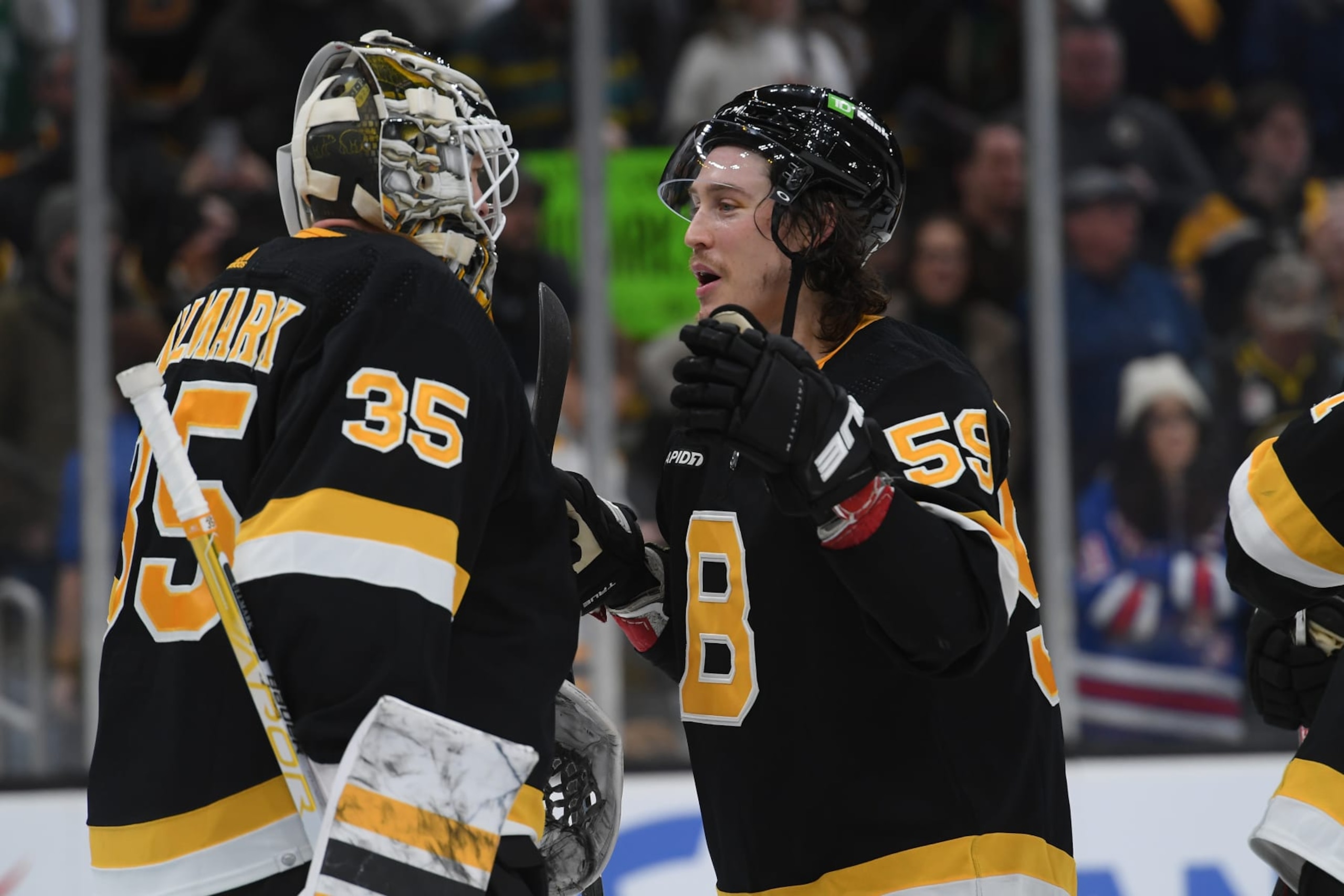 BOSTON, MASSACHUSETTS - MARCH 4: Linus Ullmark #35 and Tyler Bertuzzi #59 of the Boston Bruins celebrate the win against the New York Rangers at the TD Garden on March 4, 2023 in Boston, Massachusetts. (Photo by Steve Babineau/NHLI via Getty Images)