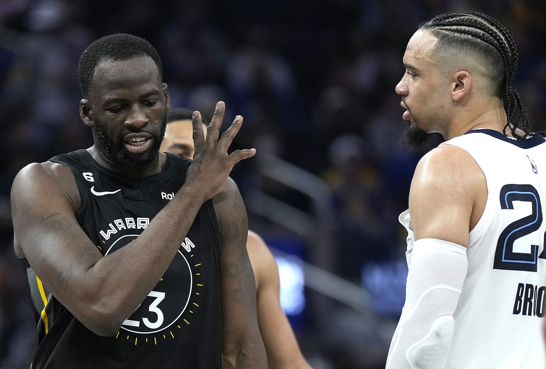 SAN FRANCISCO, CALIFORNIA - DECEMBER 25: Draymond Green #23 of the Golden State Warriors and Dillon Brooks #24 of the Memphis Grizzlies exchange word with each other during the second quarter at Chase Center on December 25, 2022 in San Francisco, California. NOTE TO USER: User expressly acknowledges and agrees that, by downloading and or using this photograph, User is consenting to the terms and conditions of the Getty Images License Agreement. (Photo by Thearon W. Henderson/Getty Images)