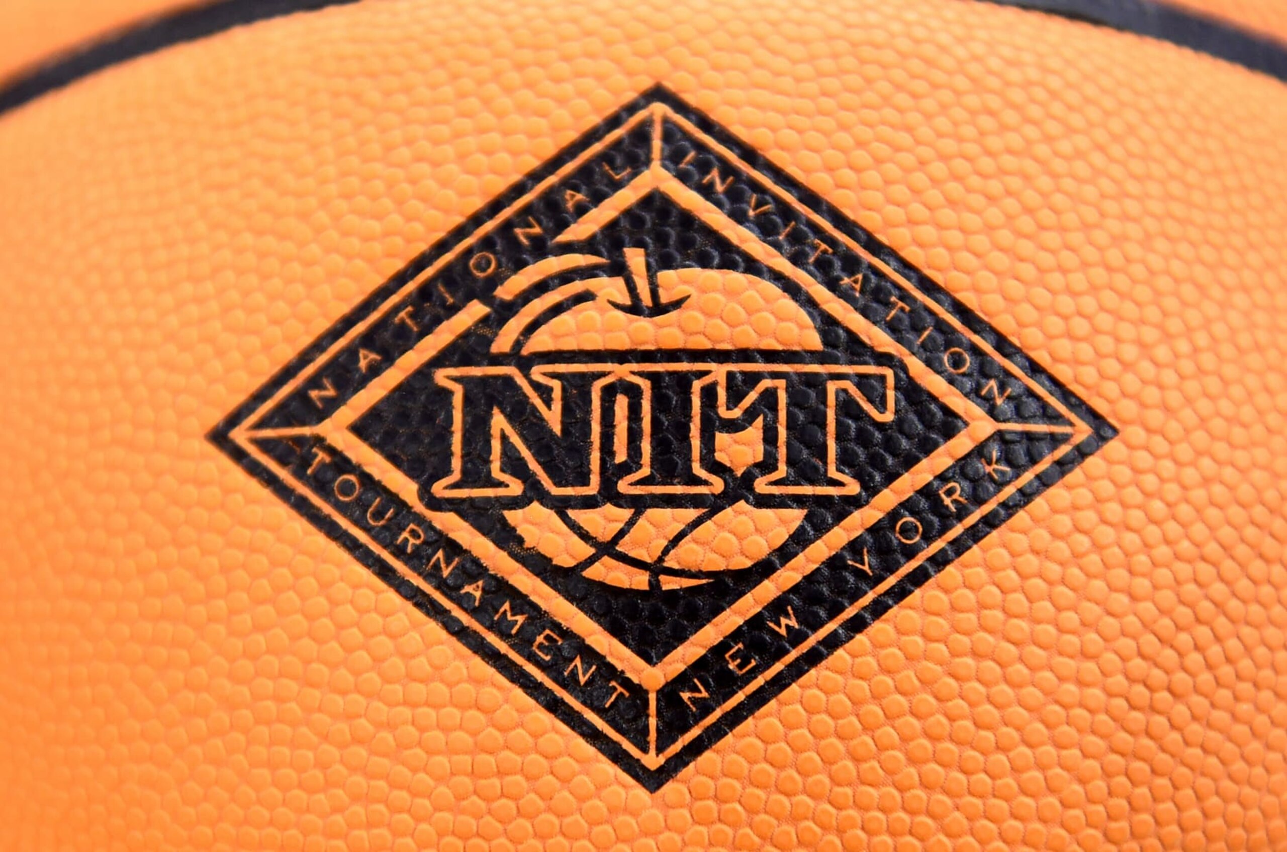 CHARLOTTESVILLE, VIRGINIA - MARCH 22: The NIT logo on the basketball before the NIT Quarterfinals between the Virginia Cavaliers and the St. Bonaventure Bonnies at John Paul Jones Arena on March 22, 2022 in Charlottesville, Virginia. (Photo by G Fiume/Getty Images)