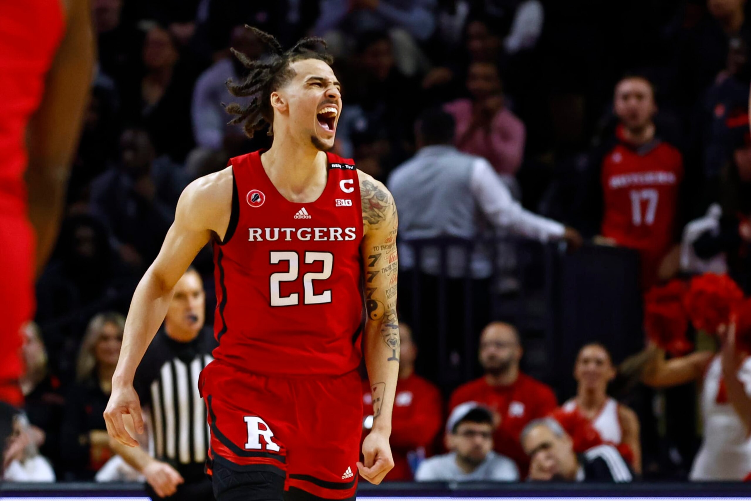 PISCATAWAY, NJ - MARCH 05: Caleb McConnell #22 of the Rutgers Scarlet Knights reacts to a basket against the Northwestern Wildcats during the first half of a game at Jersey Mike's Arena on March 5, 2023 in Piscataway, New Jersey. (Photo by Rich Schultz/Getty Images)