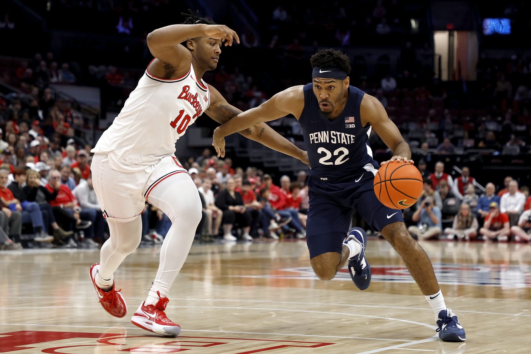 COLUMBUS, OH - FEBRUARY 23:  Jalen Pickett #22 of the Penn State Nittany Lions drives the ball against the defense of Brice Sensabaugh #10 of the Ohio State Buckeyes during the second half at the Jerome Schottenstein Center on February 23, 2023 in Columbus, Ohio. Penn State defeated Ohio State 75-71. (Photo by Kirk Irwin/Getty Images)